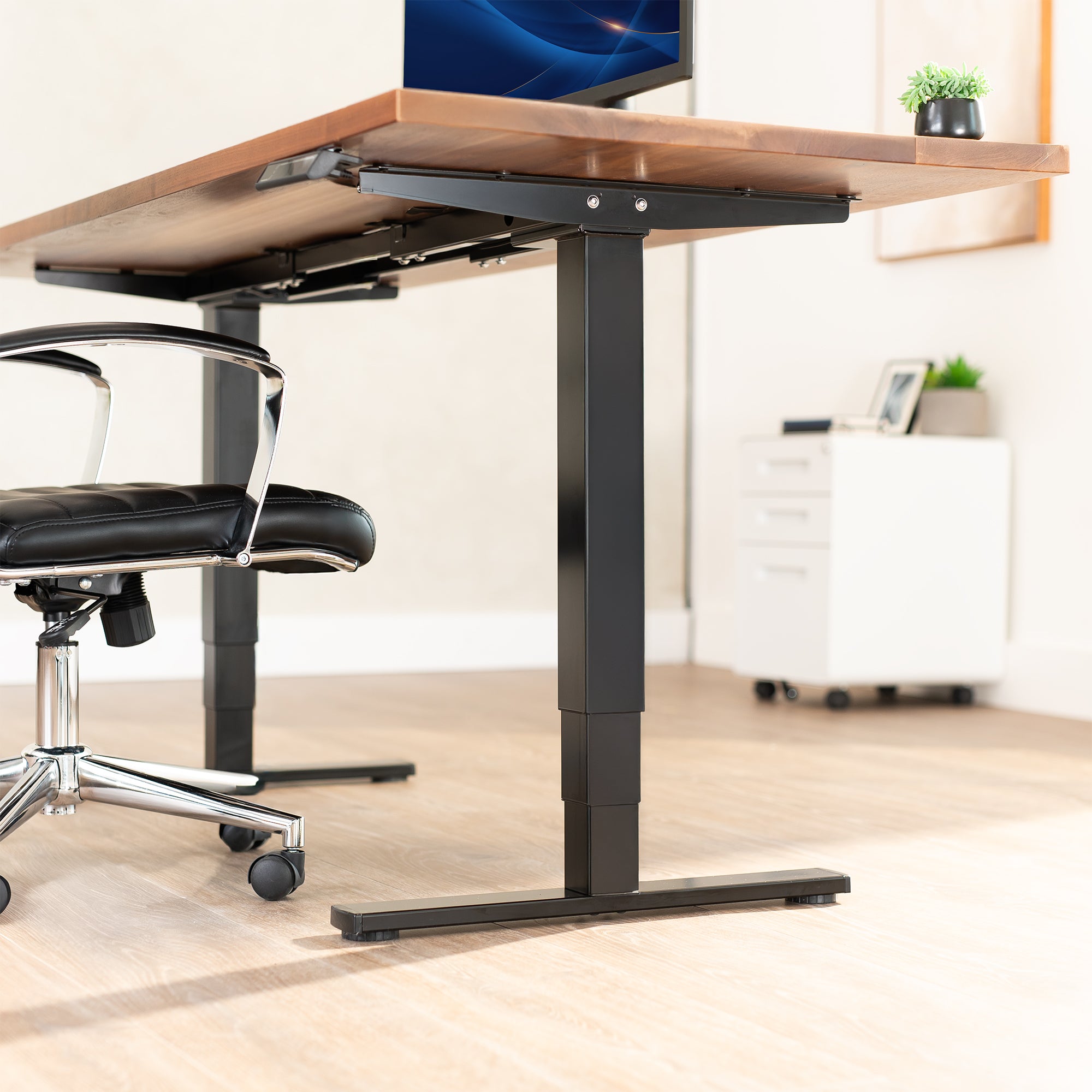 Electric height adjustable dual motor desk frame with programmable memory controller.