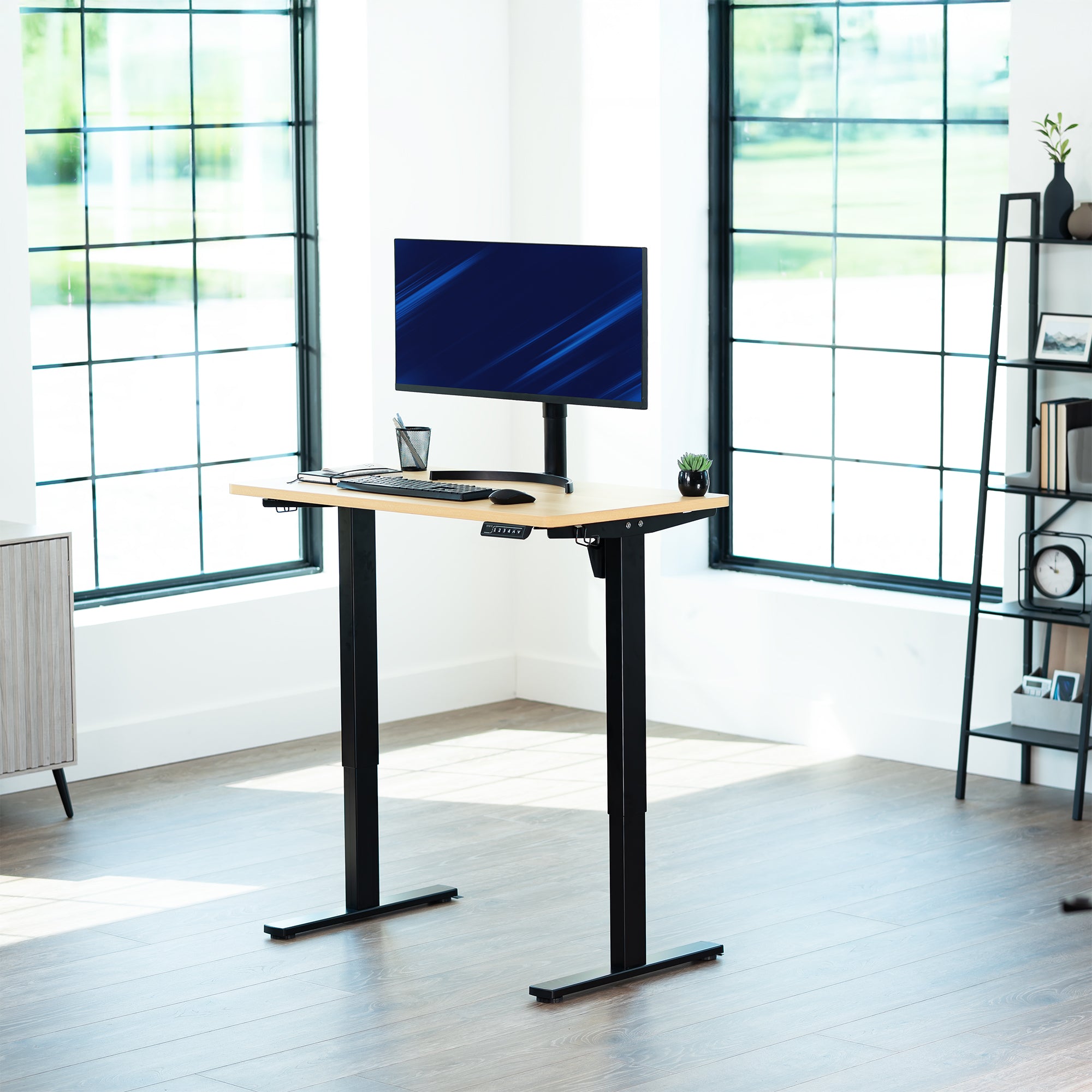 Sturdy ergonomic sit or stand active desk workstation with adjustable height using smart control panel.