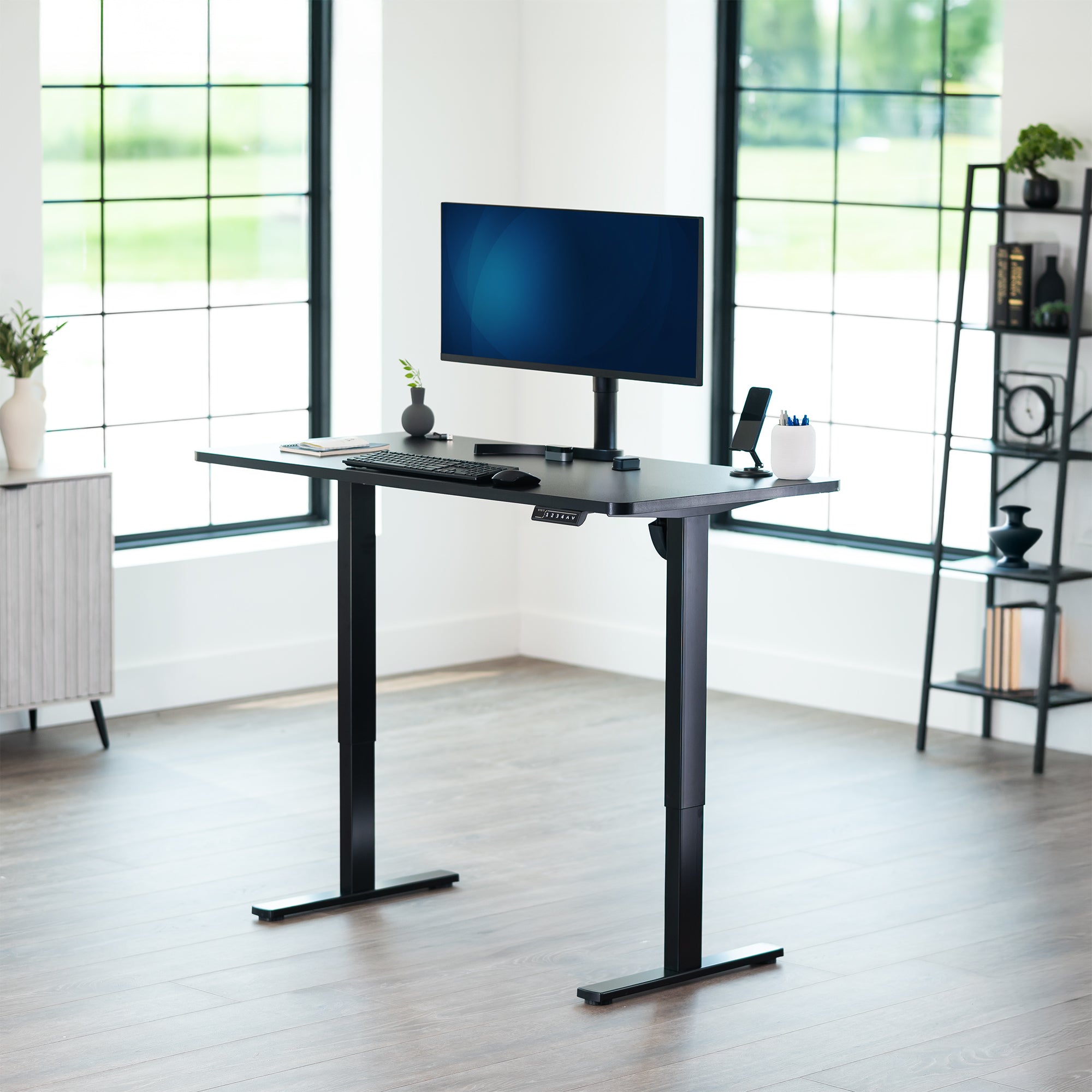 Sturdy ergonomic sit or stand active desk workstation with adjustable height using smart control panel.