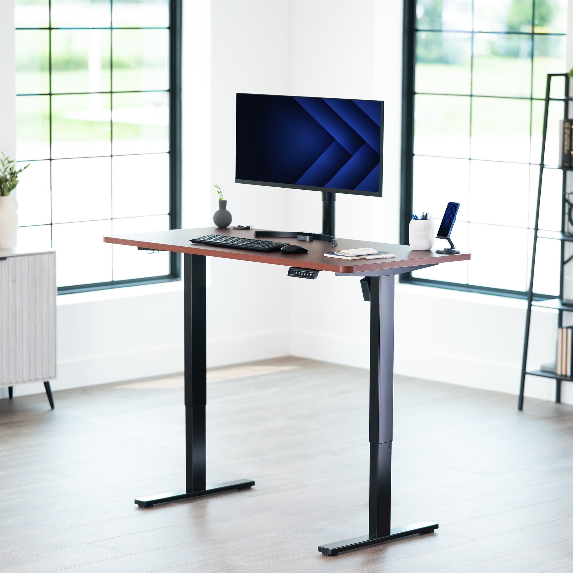 Sturdy ergonomic sit or stand active desk workstation with adjustable height using smart control panel.