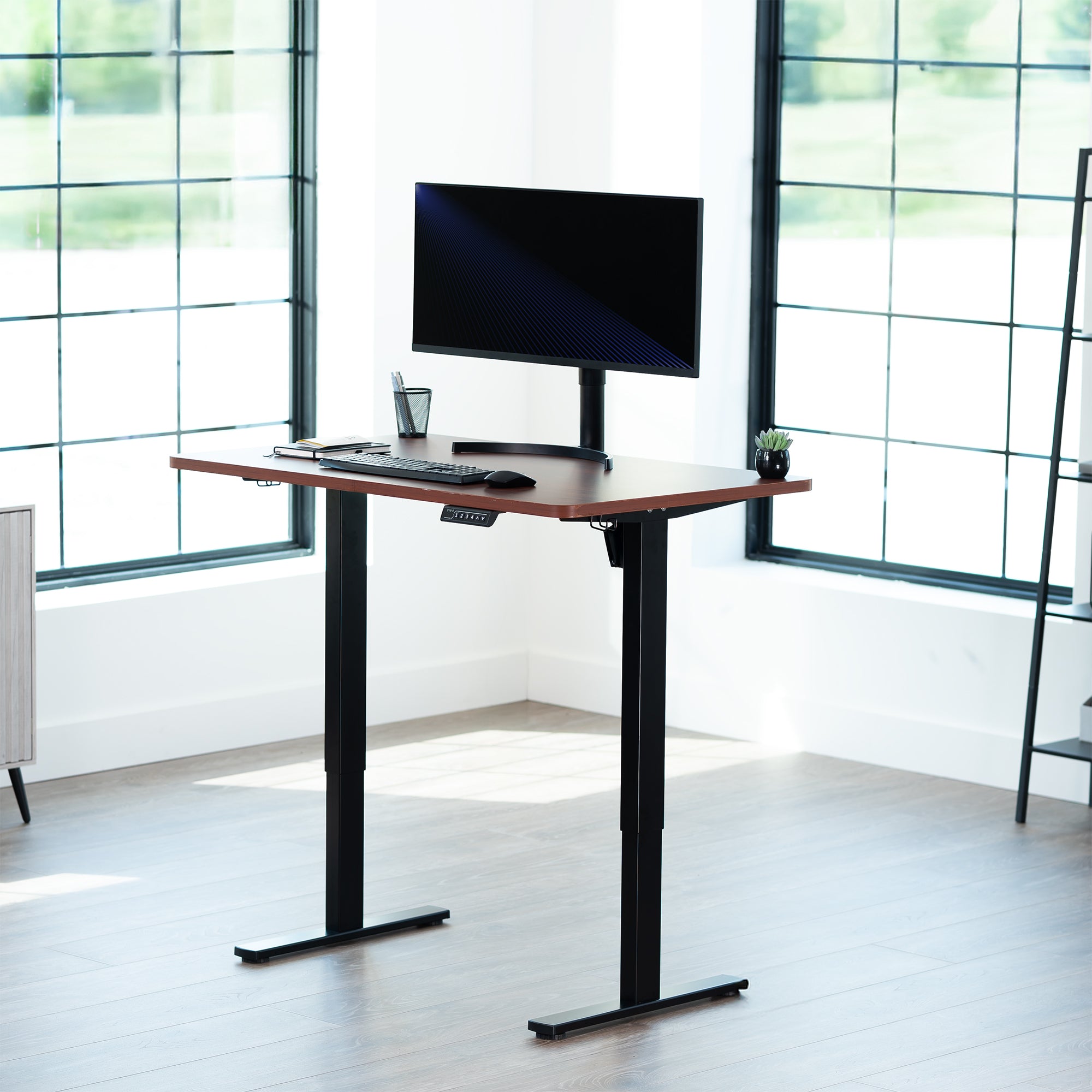 Sturdy ergonomic sit or stand active desk workstation with adjustable height using smart control panel.