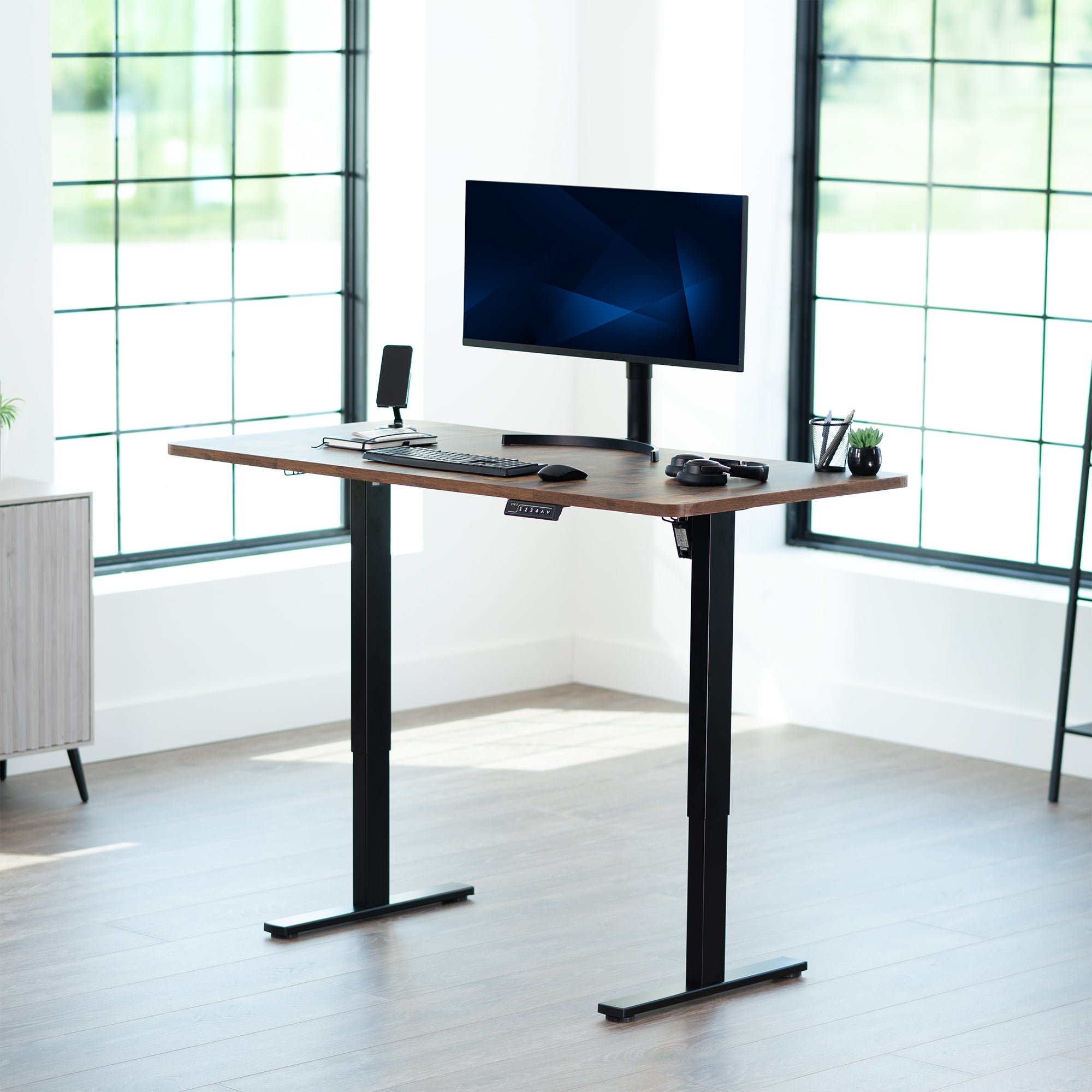 Sturdy ergonomic sit or stand active desk workstation with adjustable height using smart control panel.