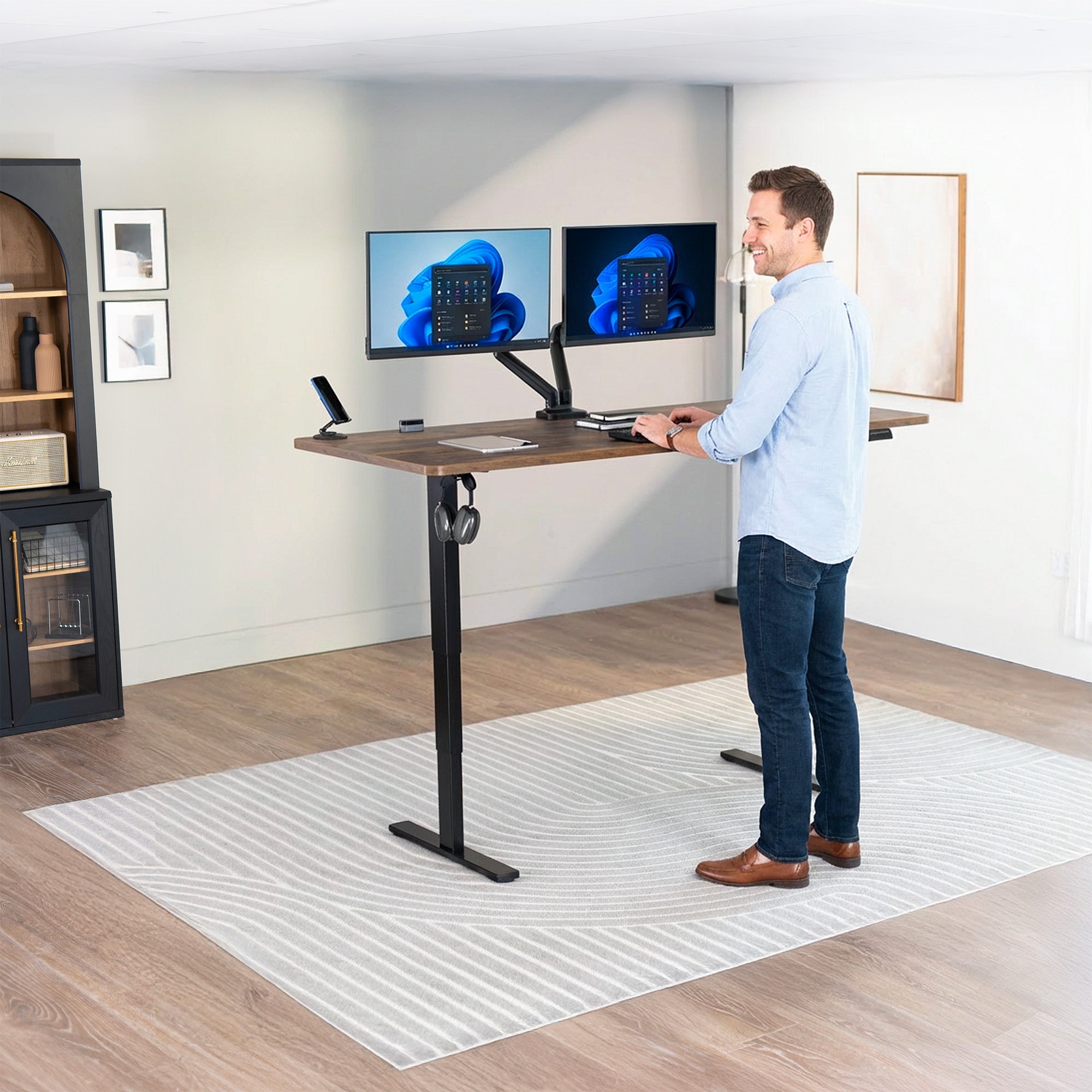 Man Standing at Vintage Brown Desktop 2E Series - 71" x 30" Electric Desk with Touch Screen Memory Controller