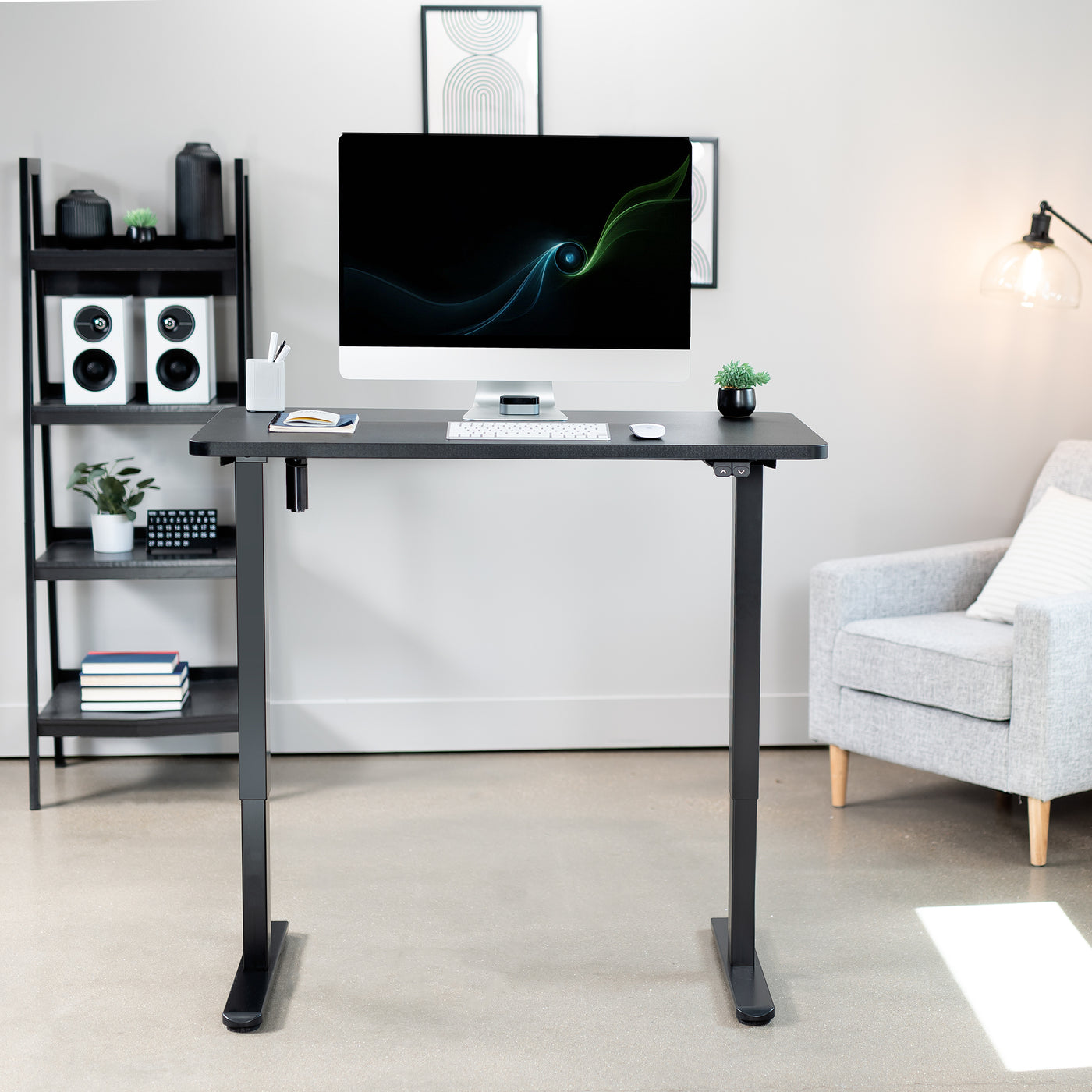 Fully furnished office space with modern sit-to-stand electric desk.