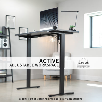 Heavy-duty electric height adjustable desktop workstation for active sit or stand efficient workspace with leg support and powerful motor.