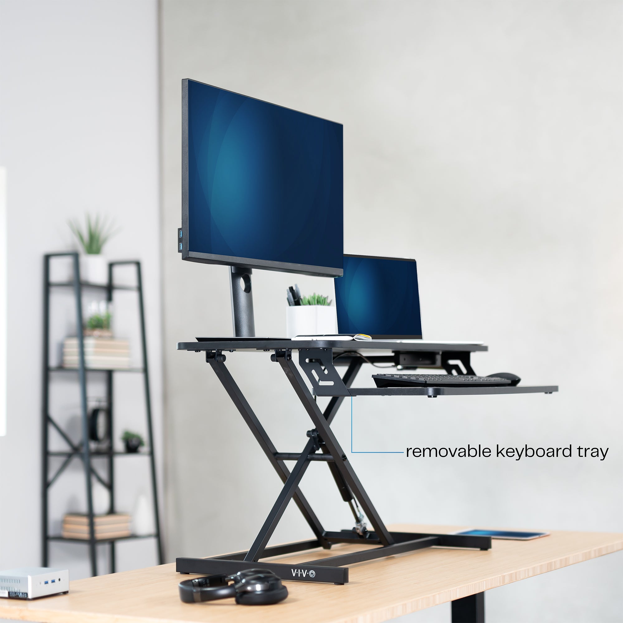 Heavy-duty height adjustable desk converter monitor riser with 2 tiers.