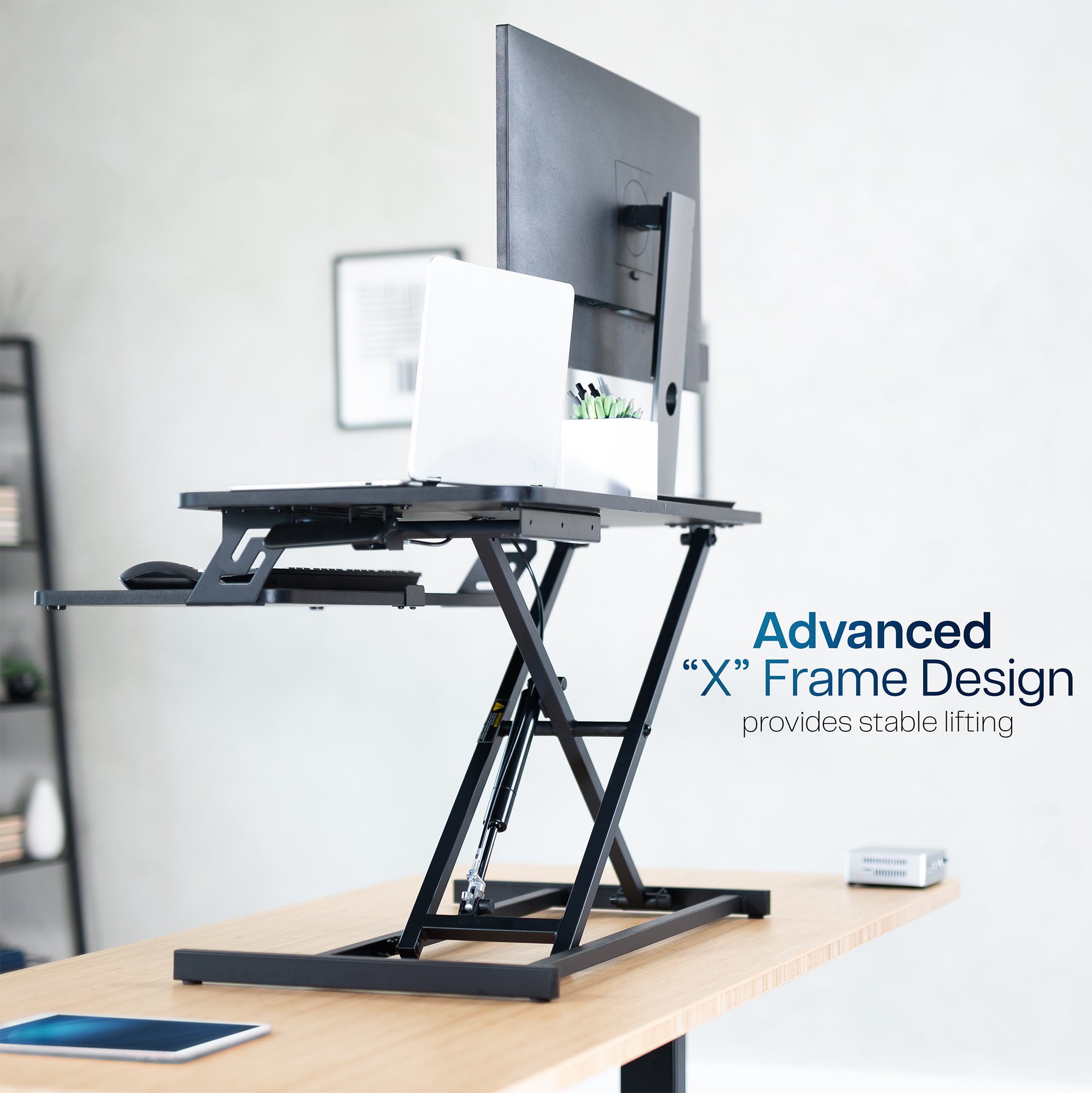 Heavy-duty height adjustable desk converter monitor riser with 2 tiers.