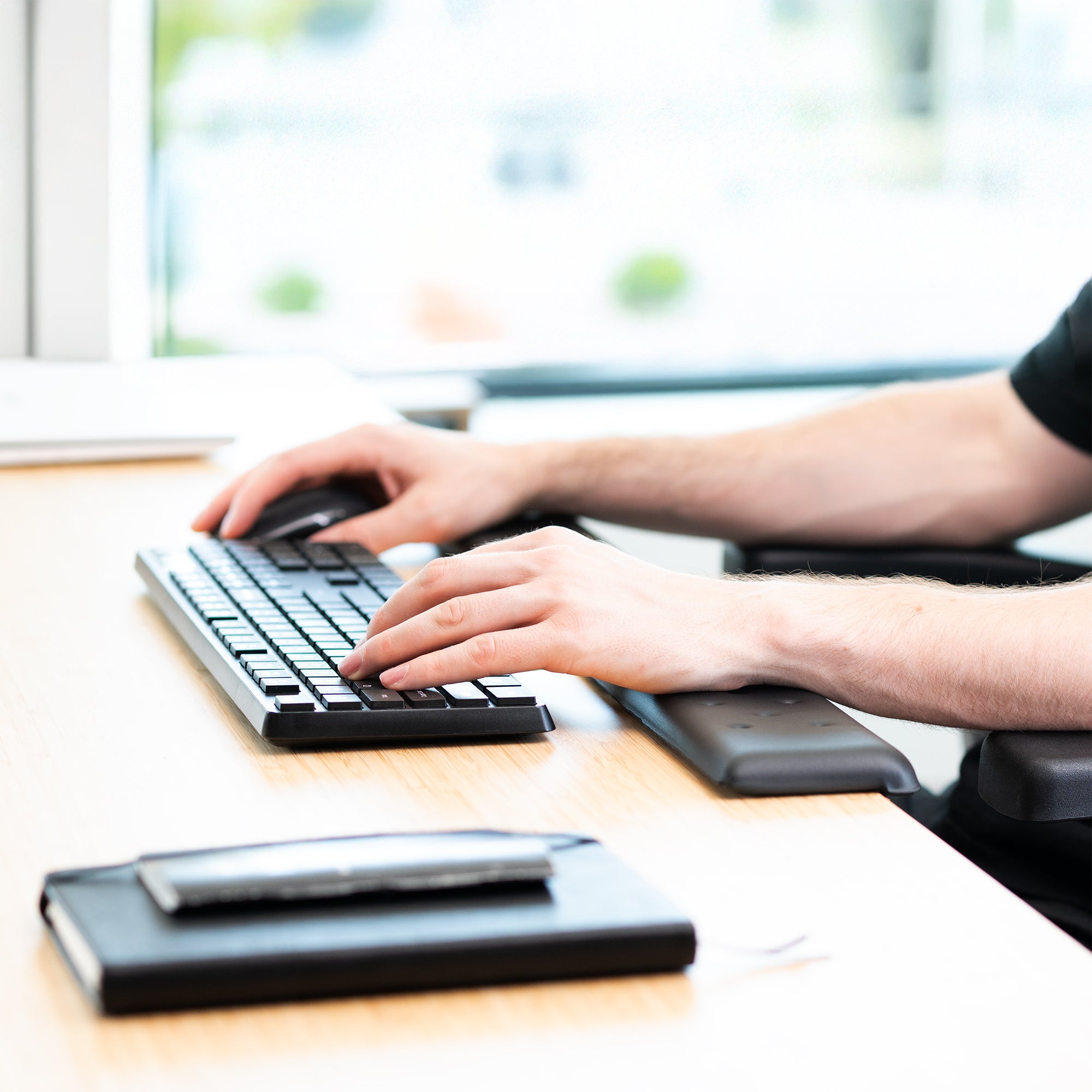 Arms resting on desk with 30in Memory Foam Wrist Pad