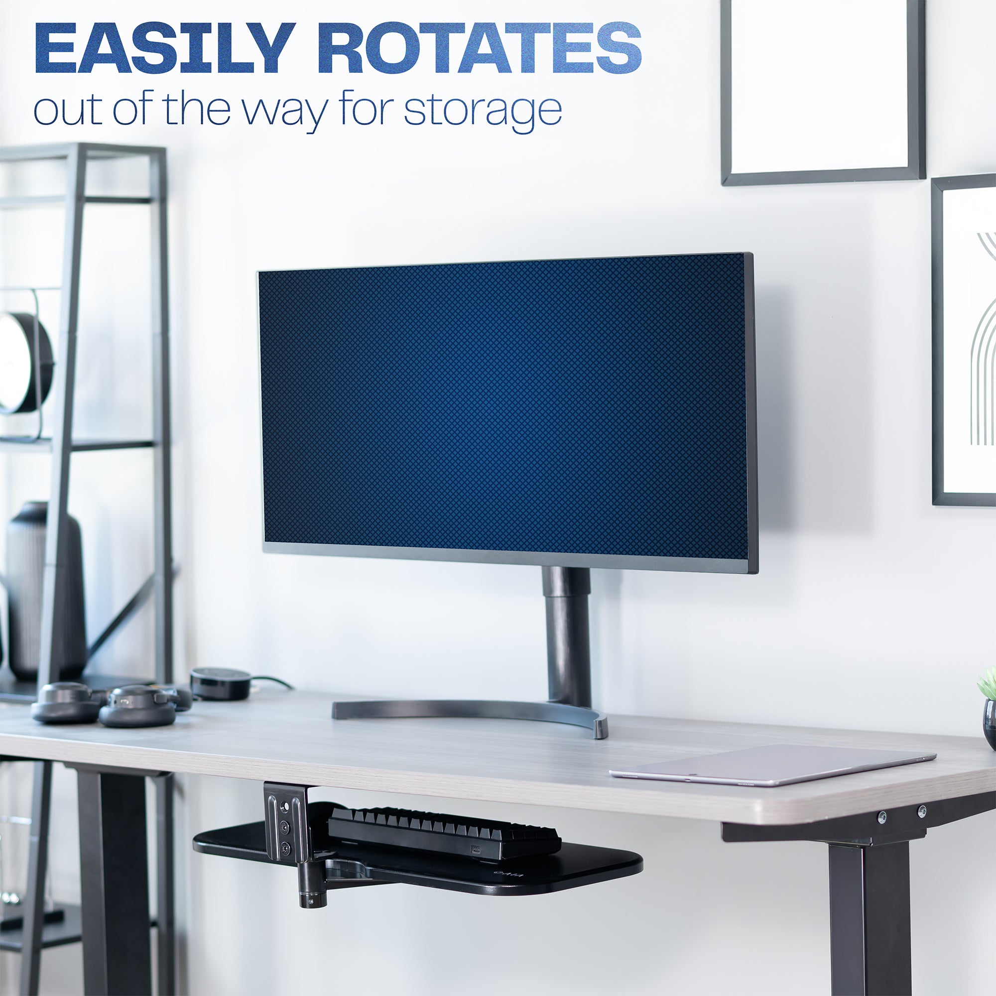 Clamp-on keyboard tray rotated under the desk for space-efficient storage.