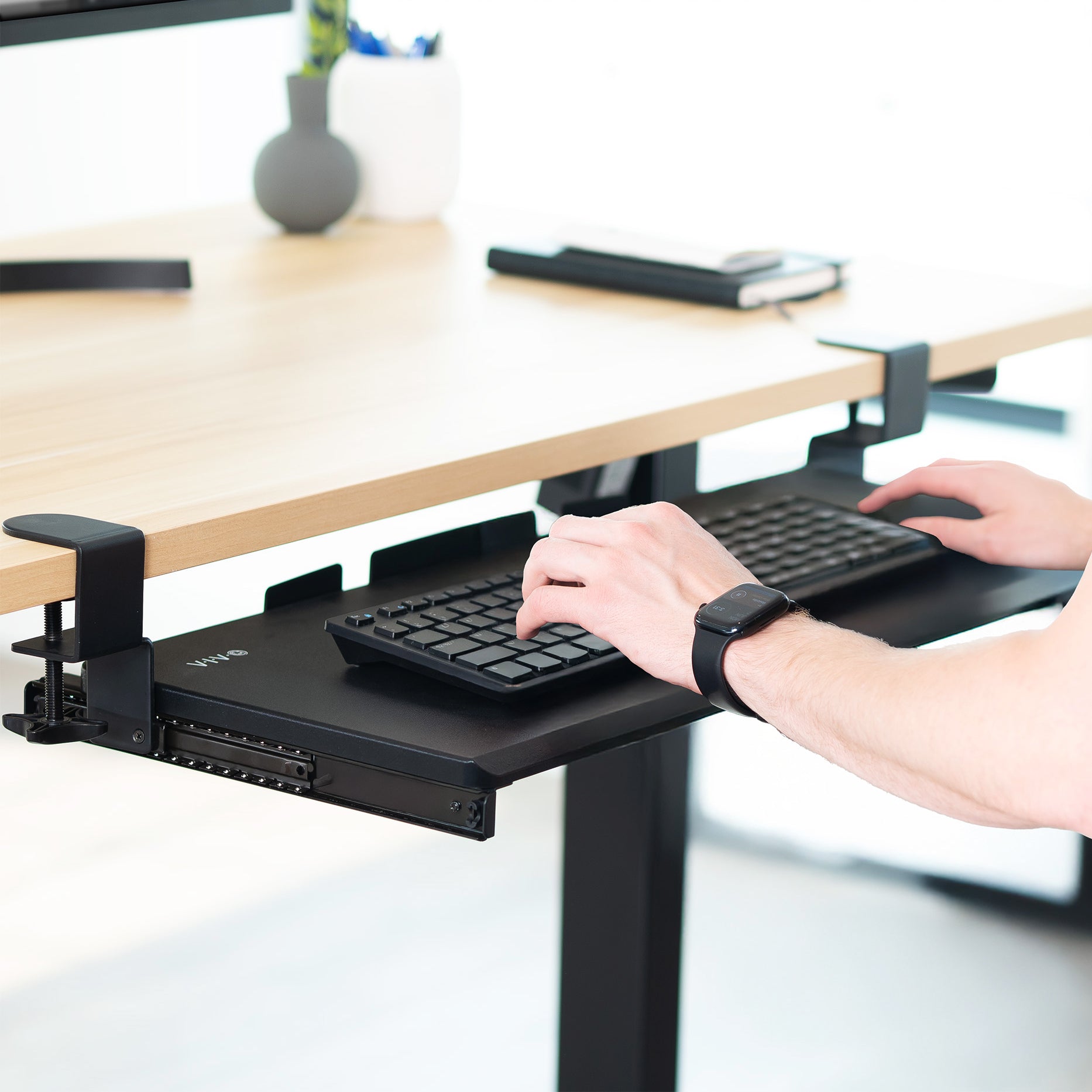 Under desk solid steel sliding keyboard tray.