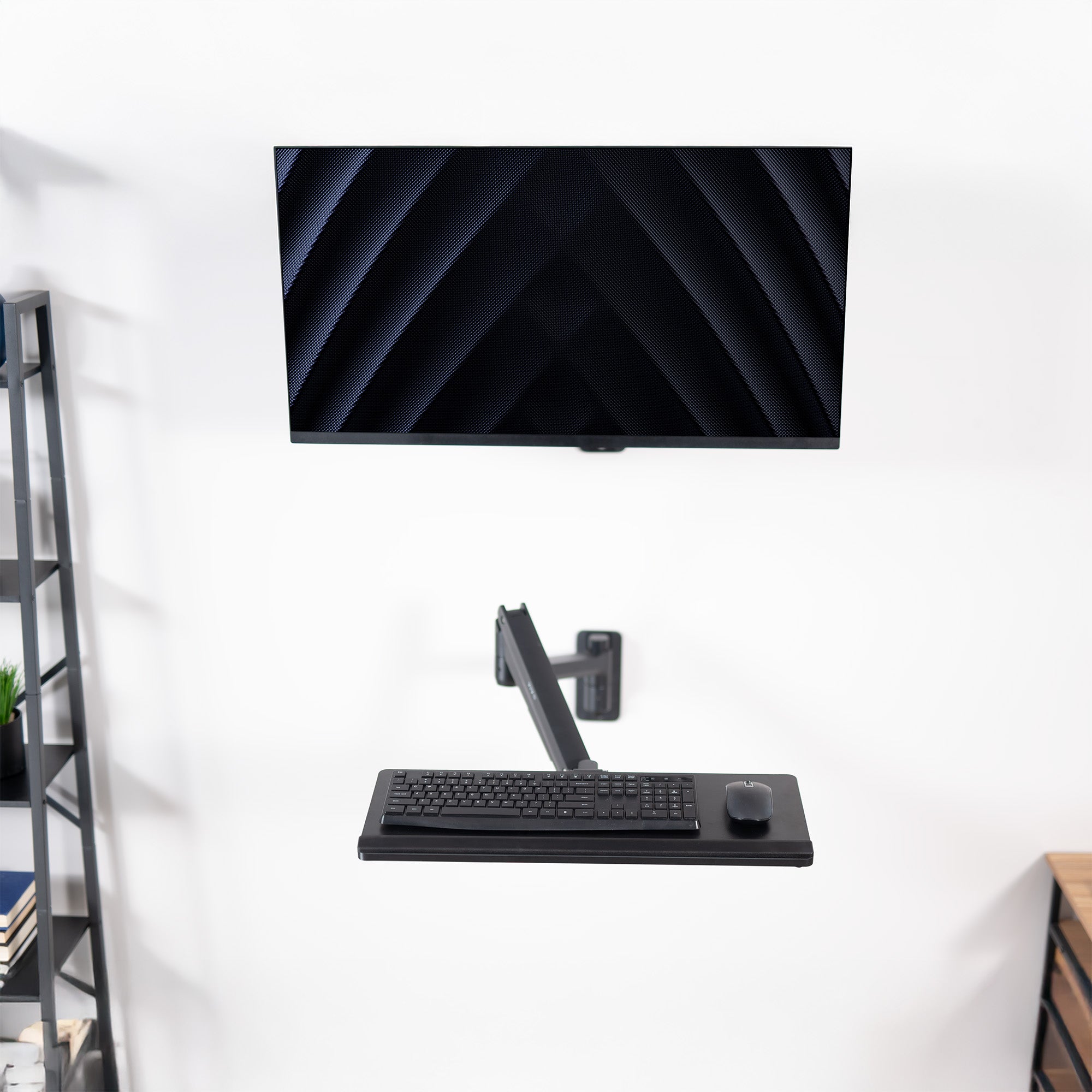A wall mounted keyboard tray with a pneumatic mechanism
