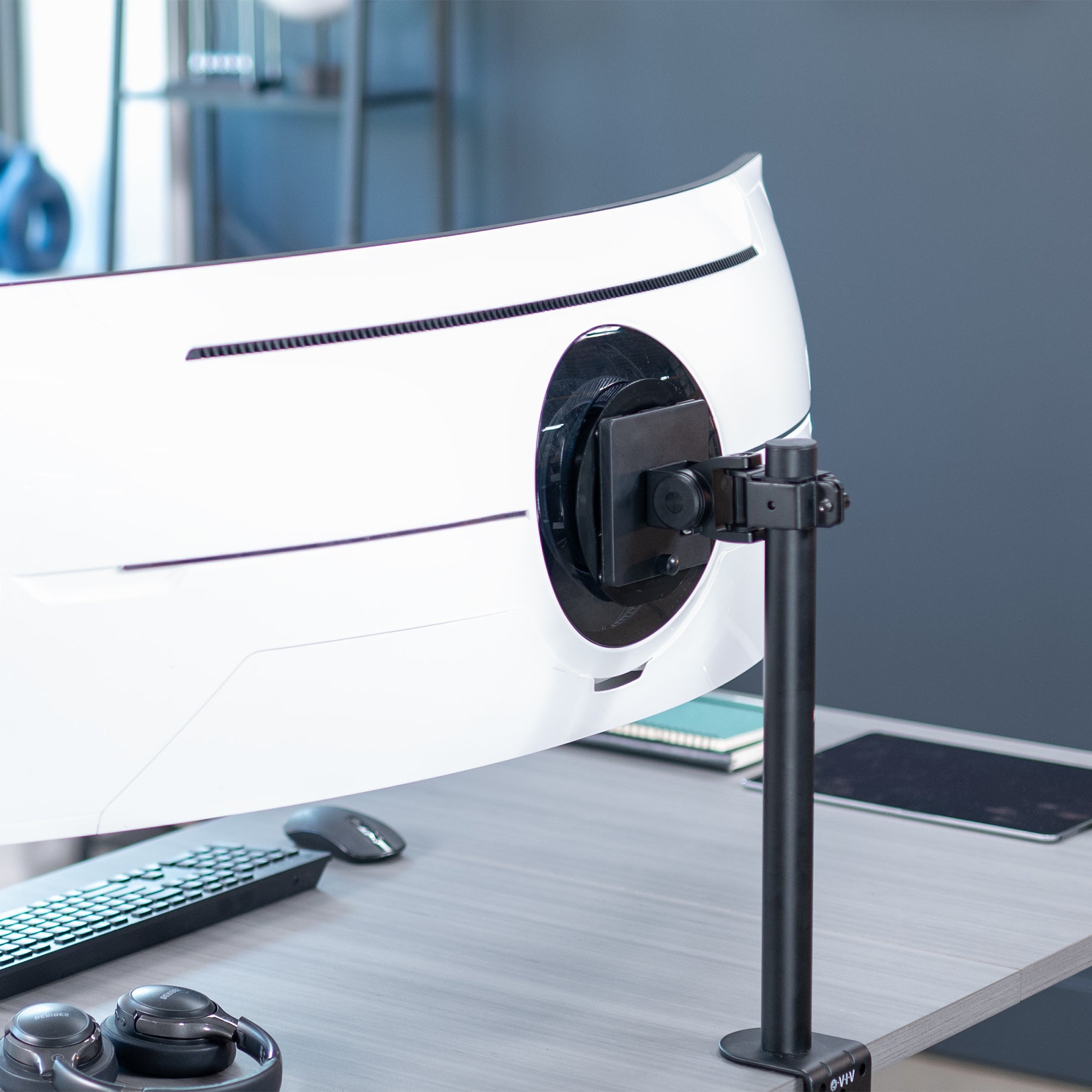Pole mounted monitor bracket for ultrawide or standard screens with a quick-release bracket and tilt, swivel, and rotation.