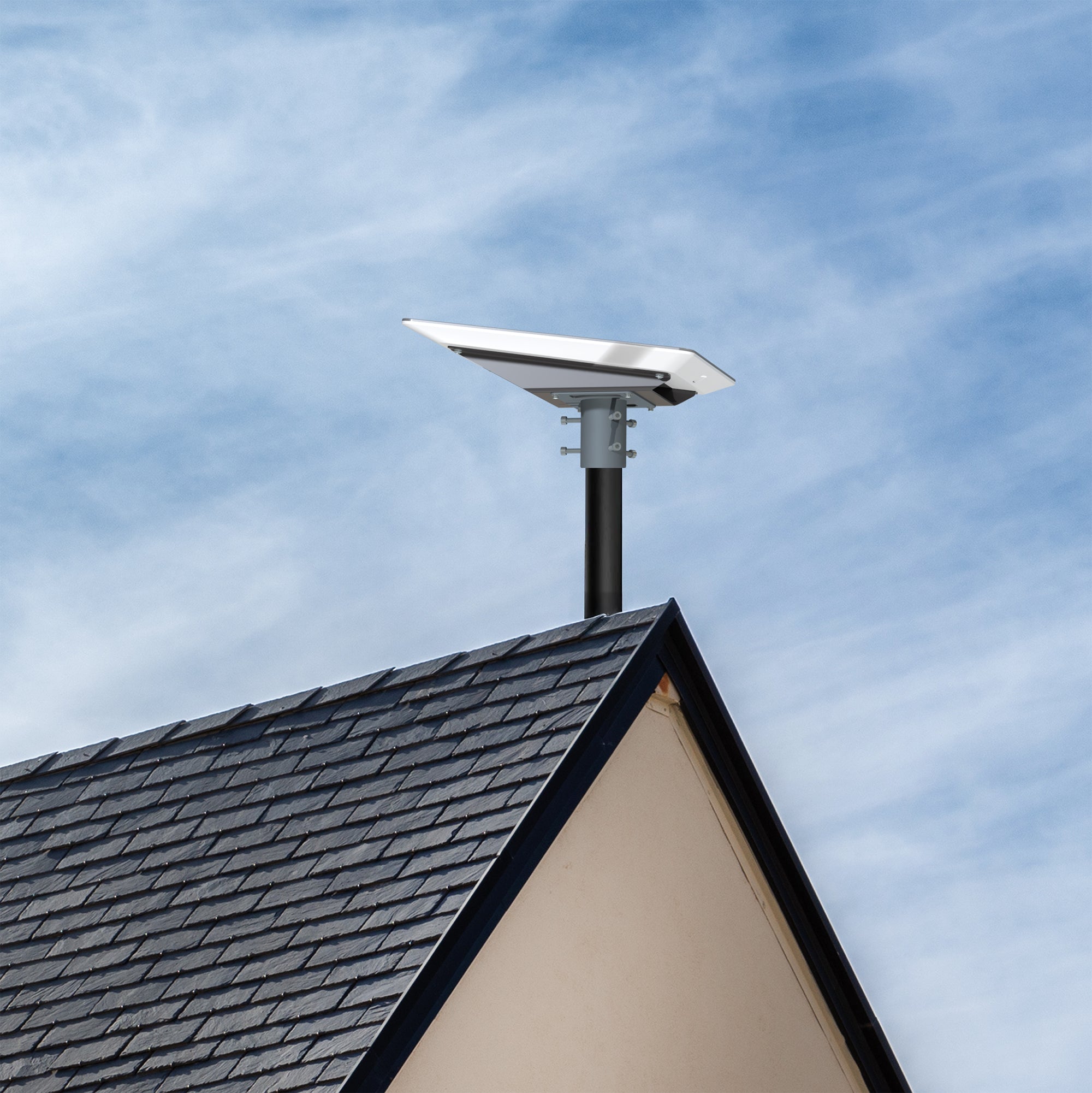 A gray pole adapter on the roof of a house.