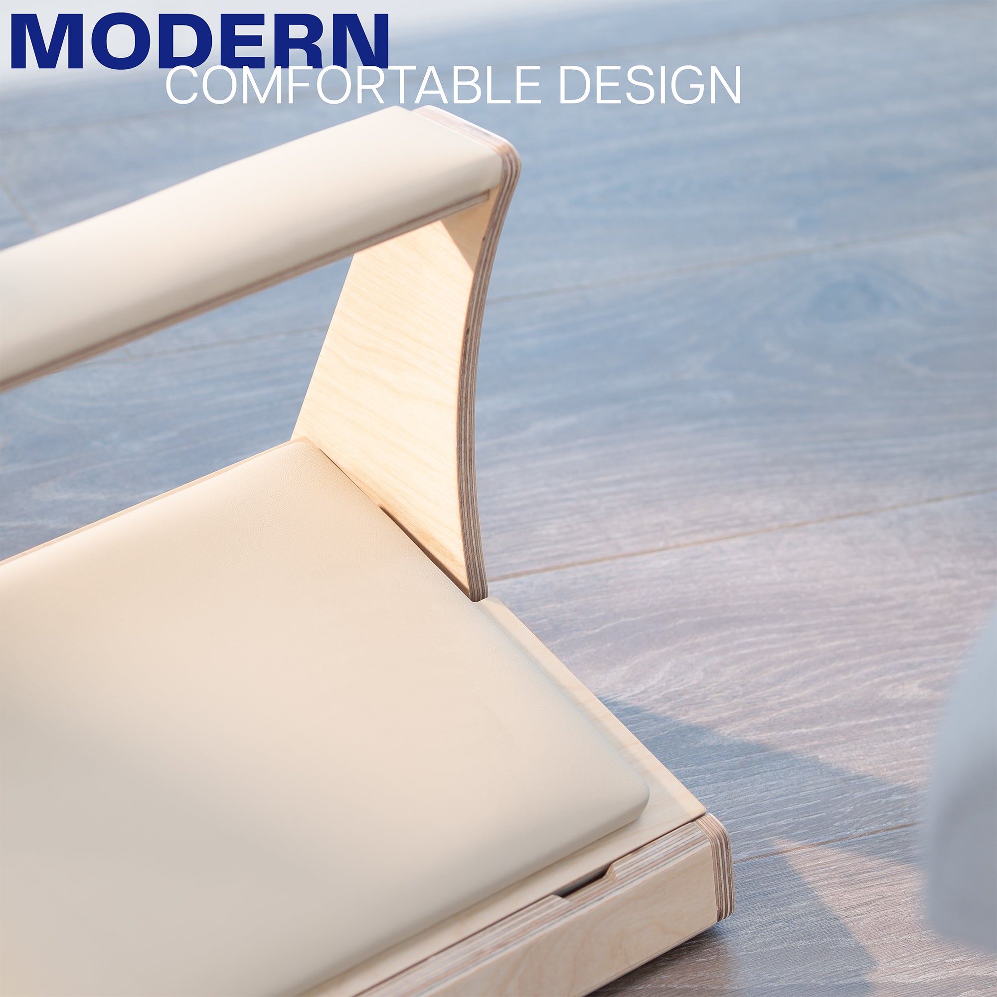 Modern footrest with text on a wooden floor.