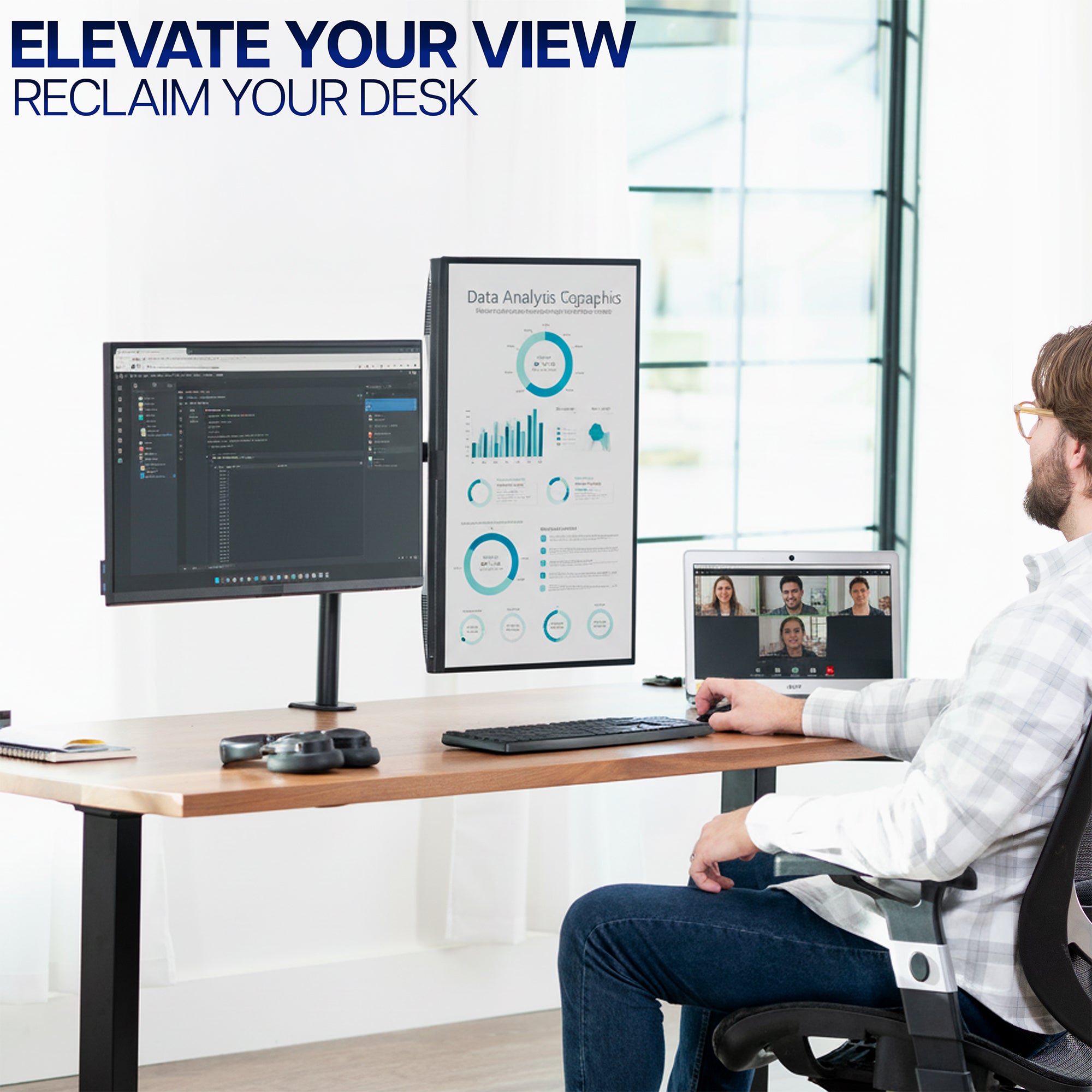 Person sitting at a desk with a Dual Monitor Desk Mount, with text 'Elevate Your View Reclaim Your Desk' above.
