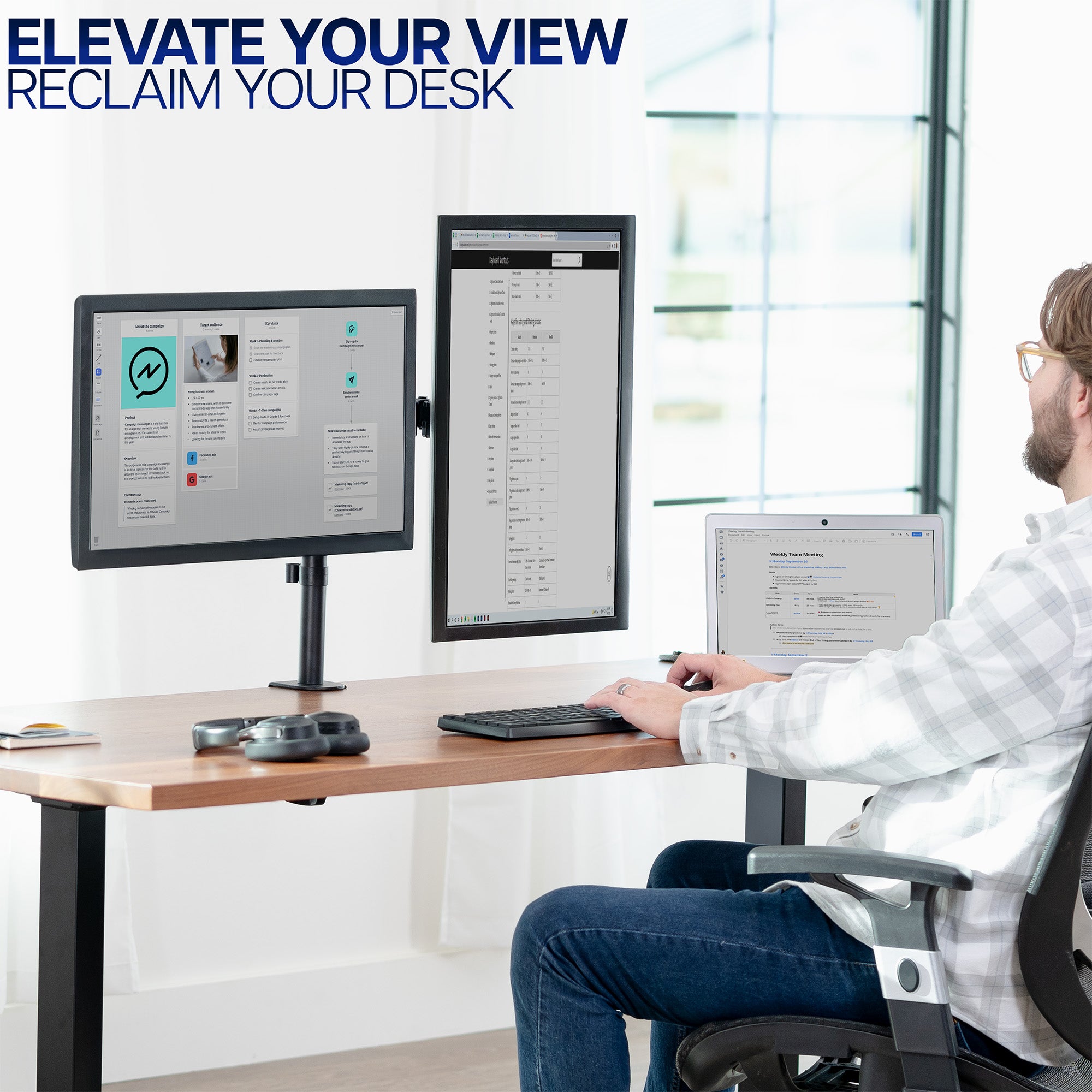 Person sitting at a desk with multiple monitors, with text 'Elevate Your View Reclaim Your Desk' above.