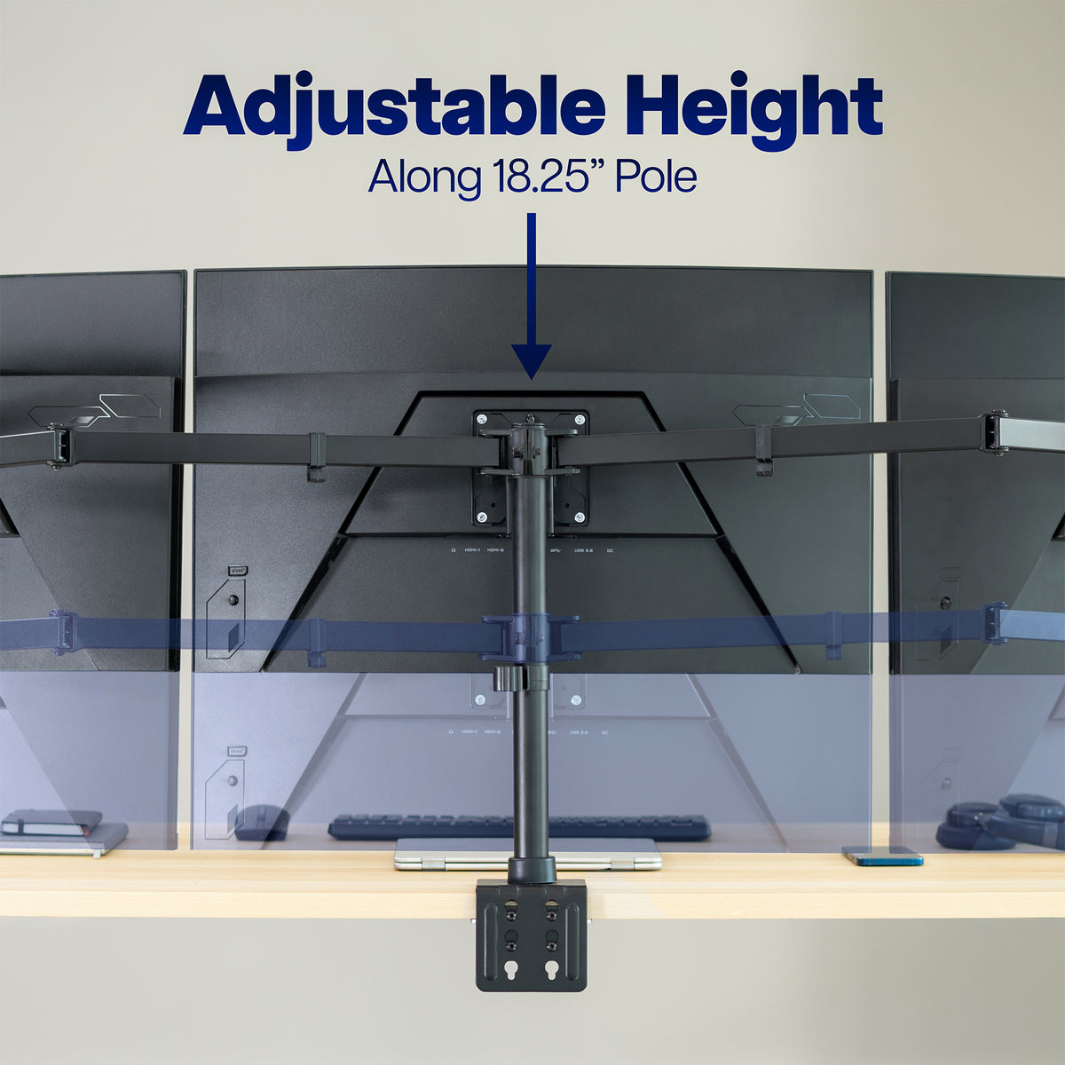 An adjustable desktop monitor mount shown mounted above a desk, with text reading 'Adjustable Height Along 18.25" Pole' and a blue arrow pointing to the mount attachment point.