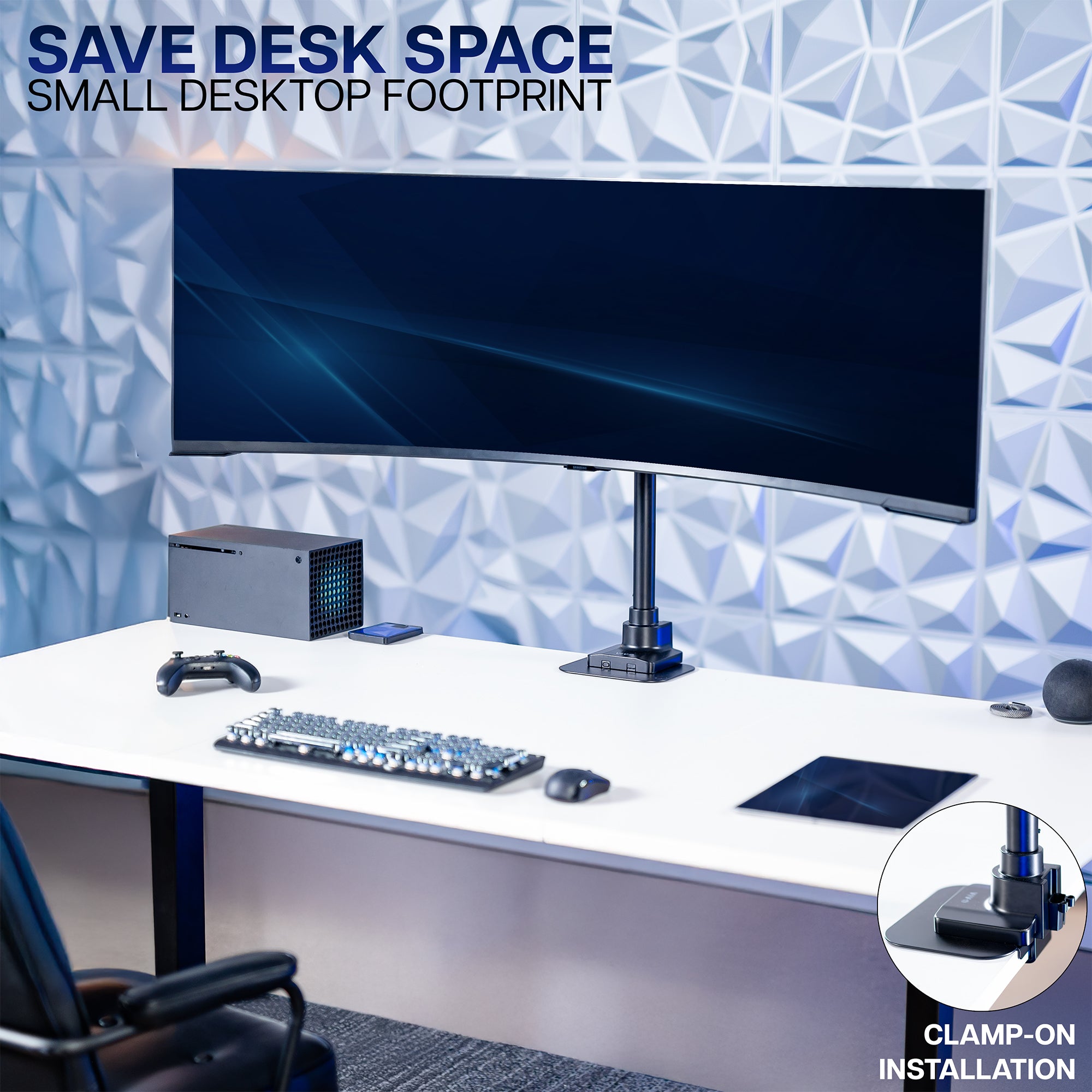 Desk setup with a monitor, keyboard, and mouse on a white desk against a geometric patterned wall.