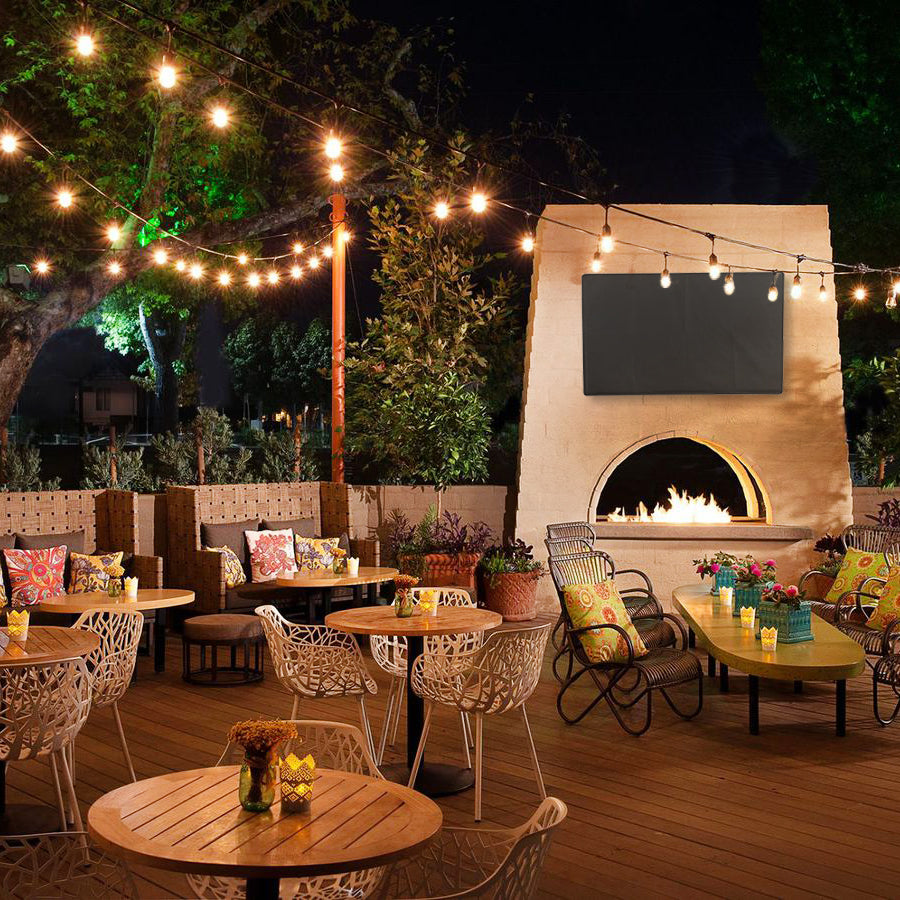 Protective flat screen TV cover in an outdoor patio area.