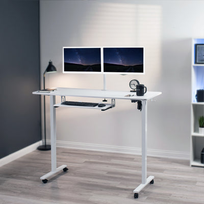 Sturdy mobile electric sit to stand height adjustable ergonomic desk workstation with keyboard tray and accessory hooks for convenient productive workspace.