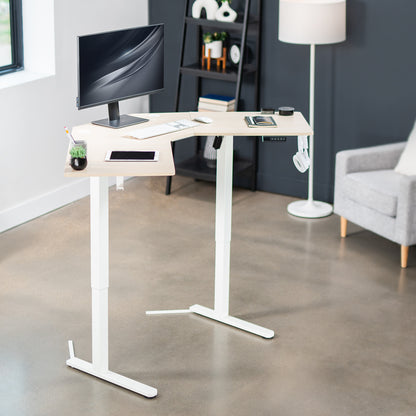 Heavy-duty electric height adjustable corner desk workstation for active sit or stand efficient workspace.