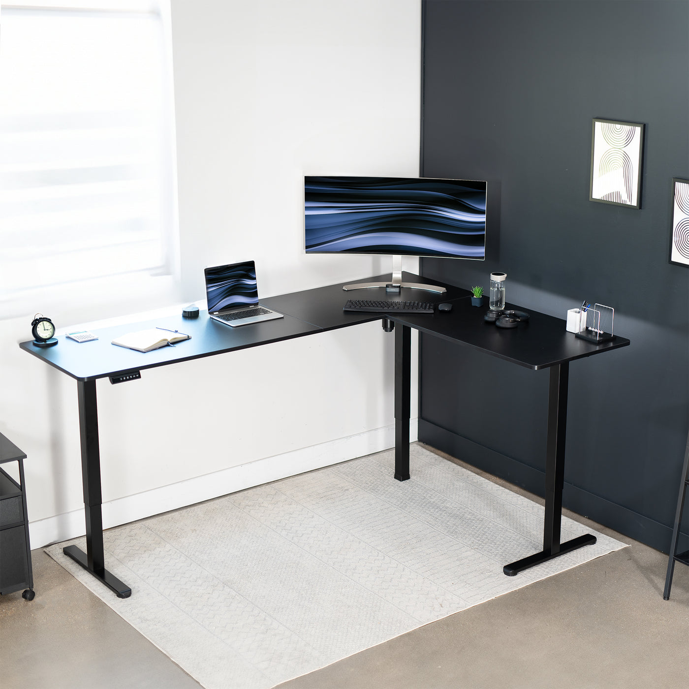 Electric heavy-duty large corner desk workstation for modern office workspaces.