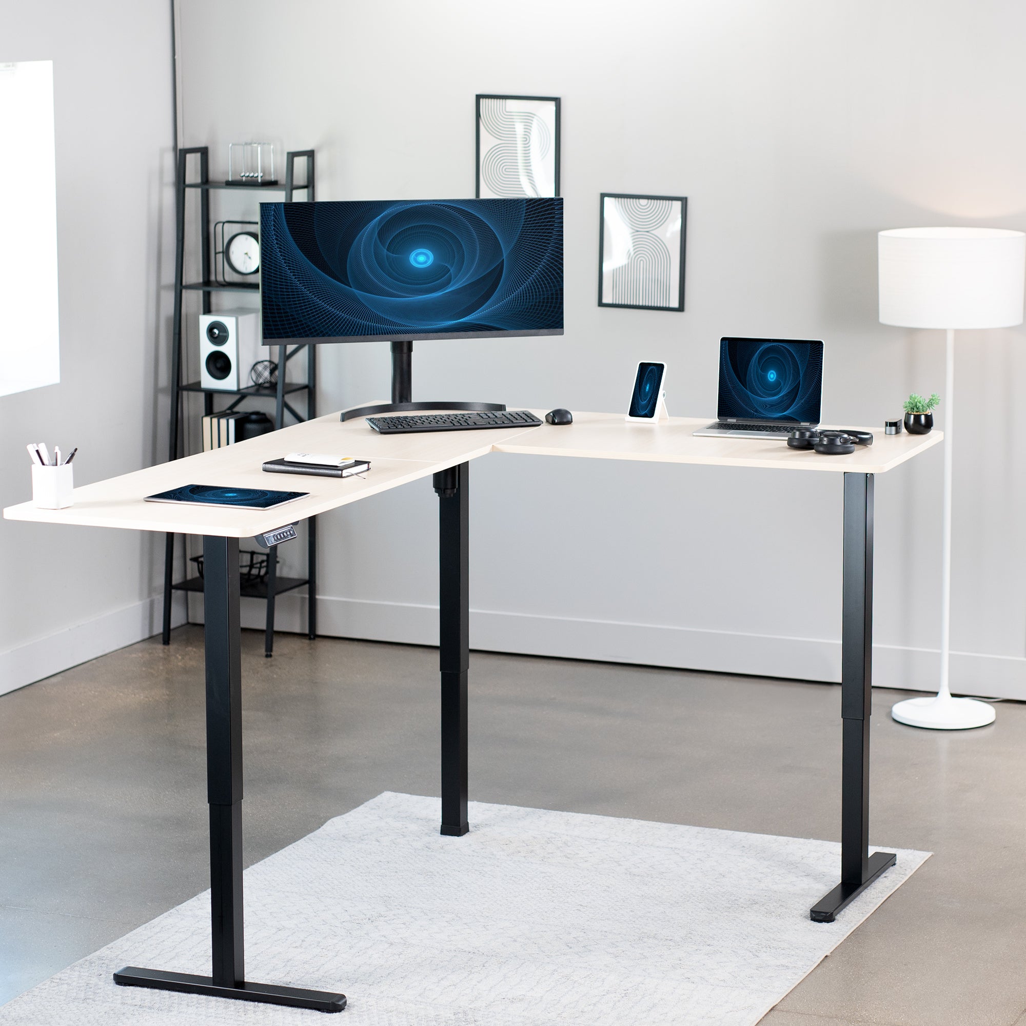 Heavy-duty electric height adjustable corner desk workstation for active sit or stand efficient workspace.