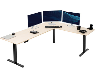 Electric heavy-duty large corner desk workstation for modern office workspaces.