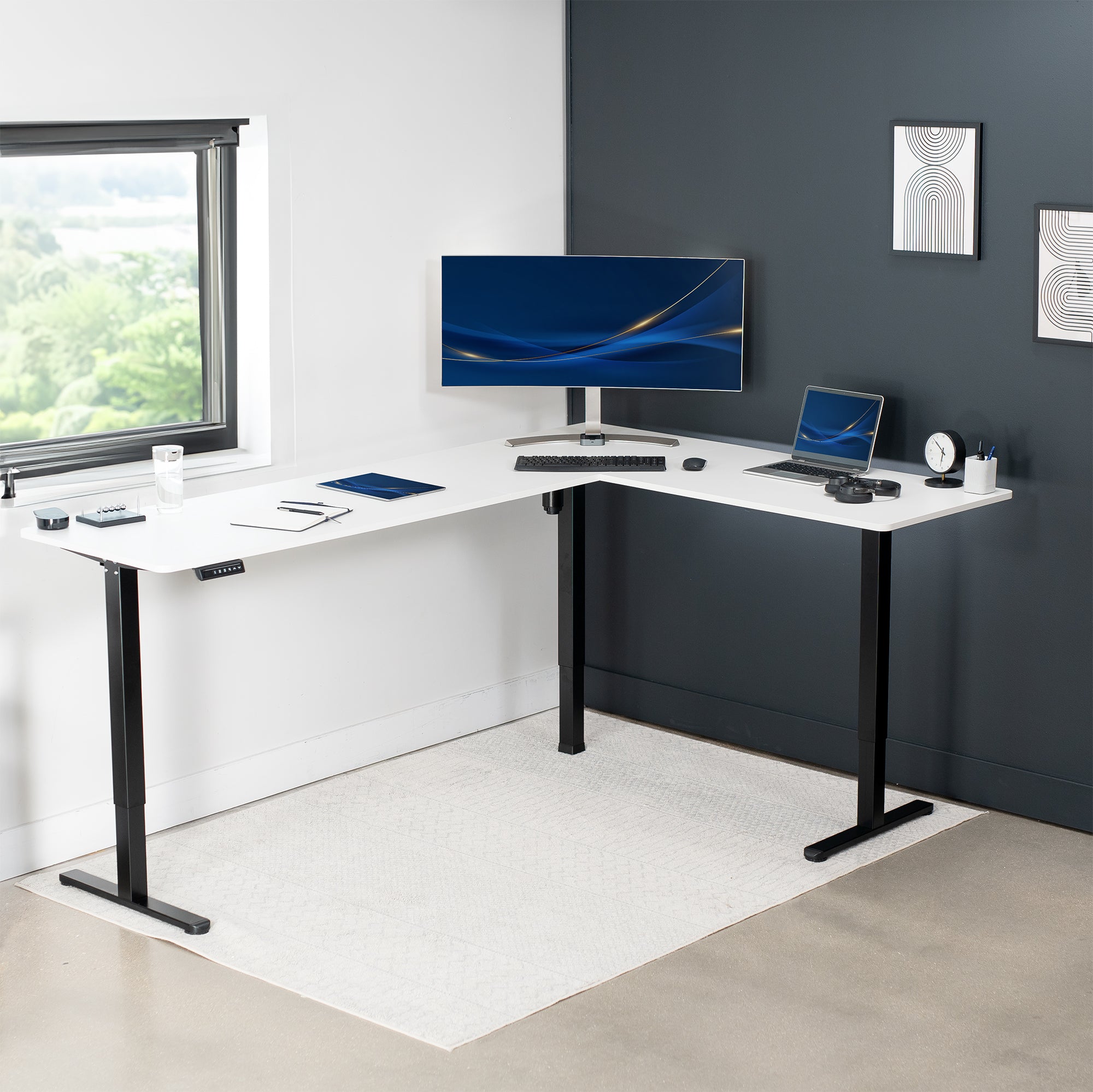 Electric heavy-duty large corner desk workstation for modern office workspaces.