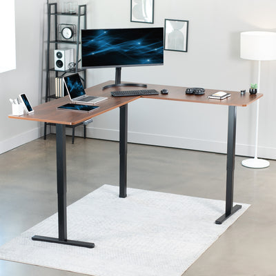 Electric heavy-duty corner desk workstation for modern office workspaces.