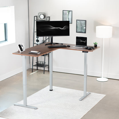 Electric heavy-duty corner desk workstation for modern office workspaces.