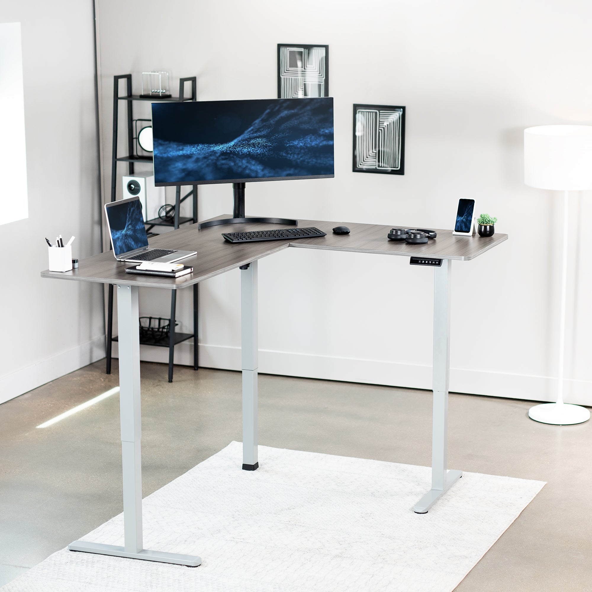 Electric heavy-duty corner desk workstation for modern office workspaces.