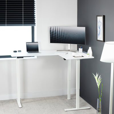 Electric heavy-duty corner desk workstation for modern office workspaces.