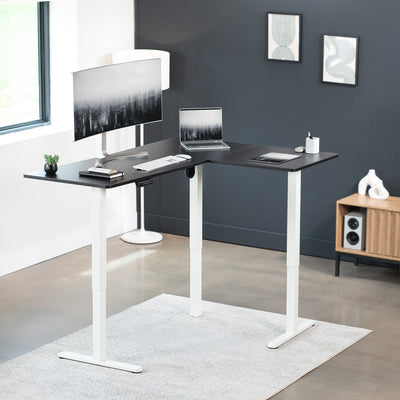 Electric heavy-duty corner desk workstation for modern office workspaces.