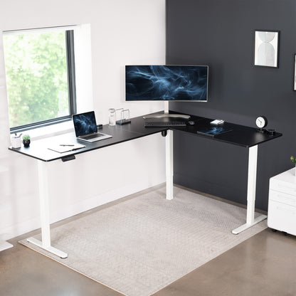 Electric heavy-duty large corner desk workstation for modern office workspaces.