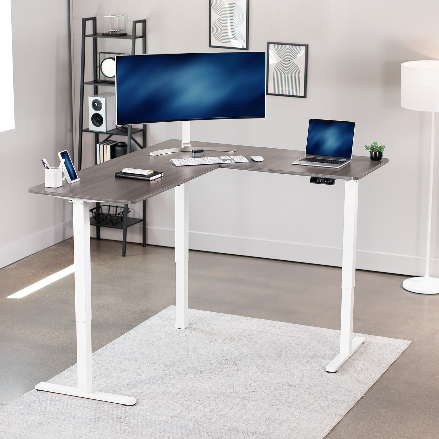 Electric heavy-duty corner desk workstation for modern office workspaces.