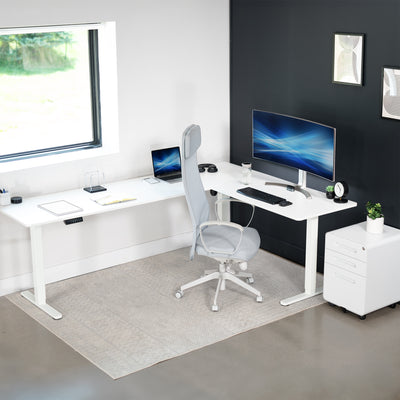 Electric heavy-duty large corner desk workstation for modern office workspaces.