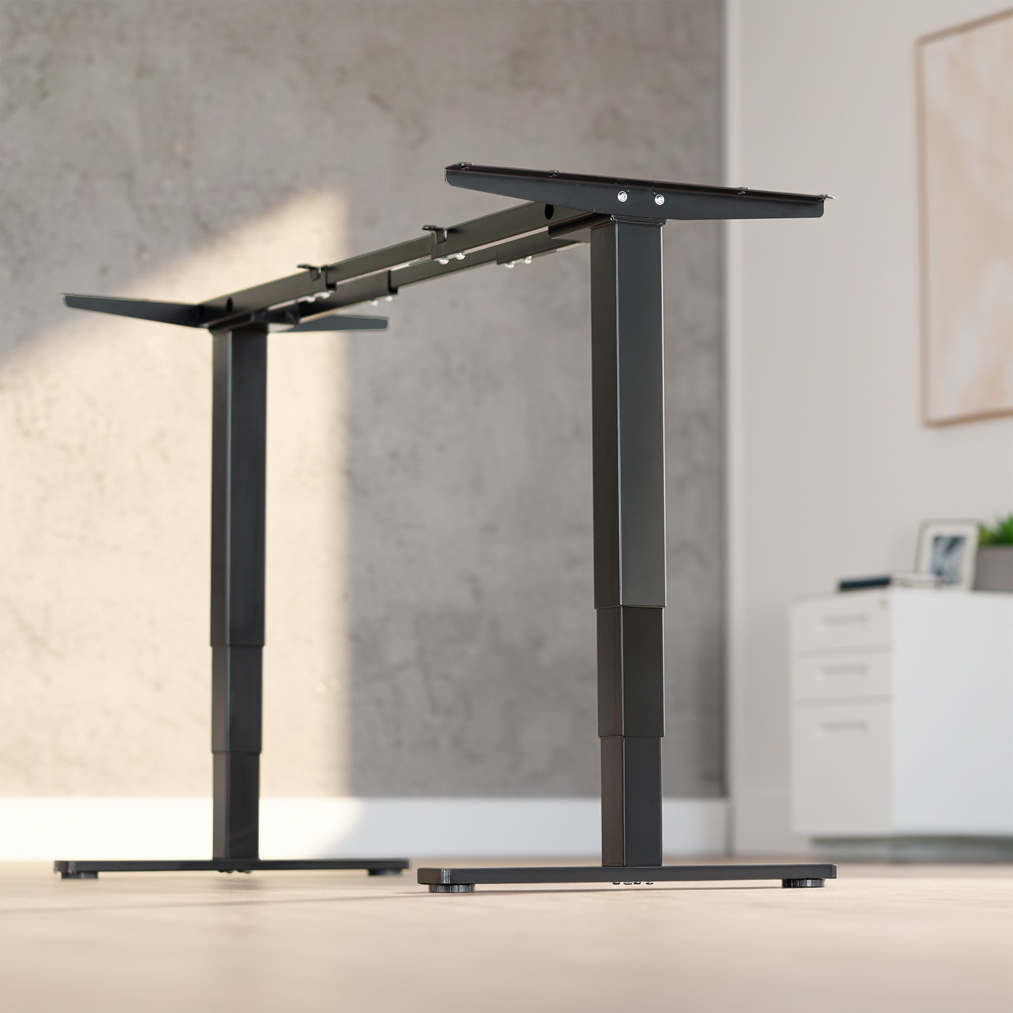 Electric height adjustable dual motor desk frame with programmable memory controller.