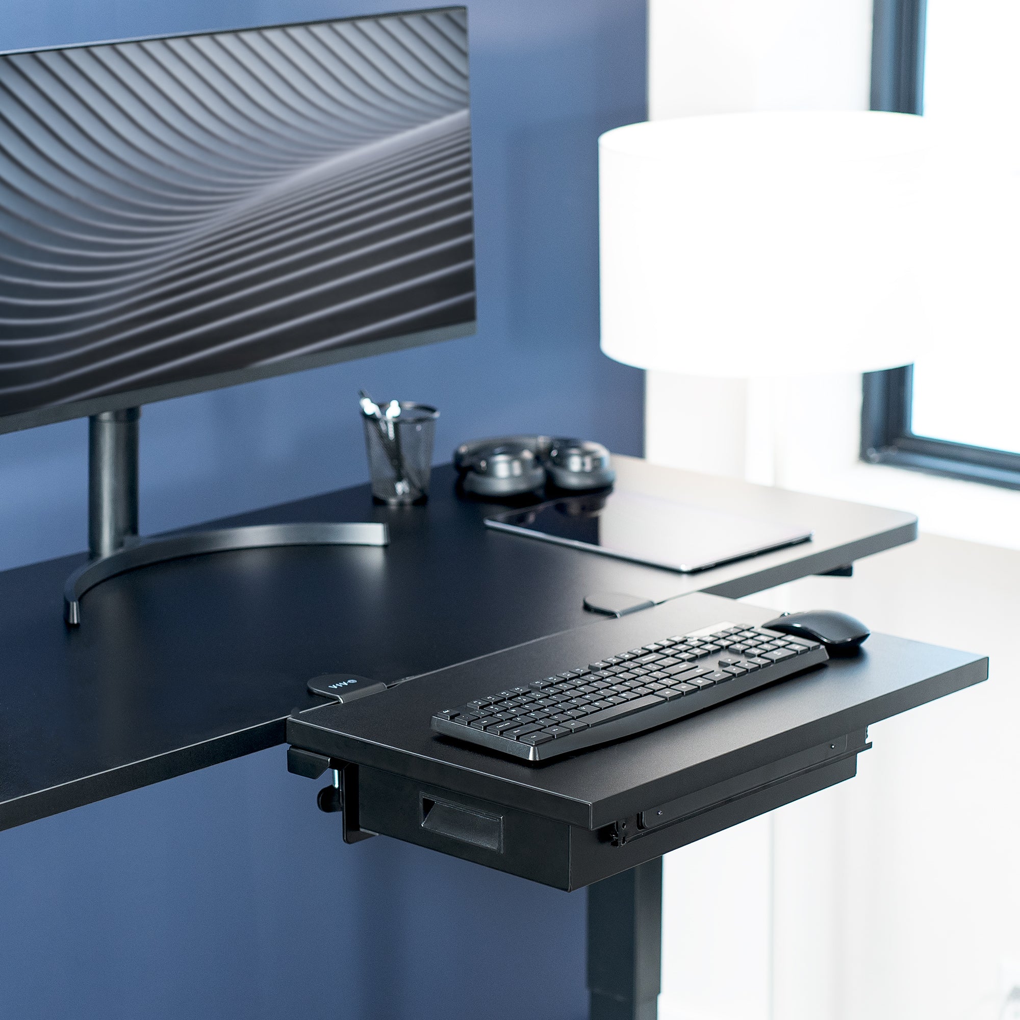 Sturdy sleek clamp-on desk extender with pull-out storage drawer. Can be mounted anywhere on desk.