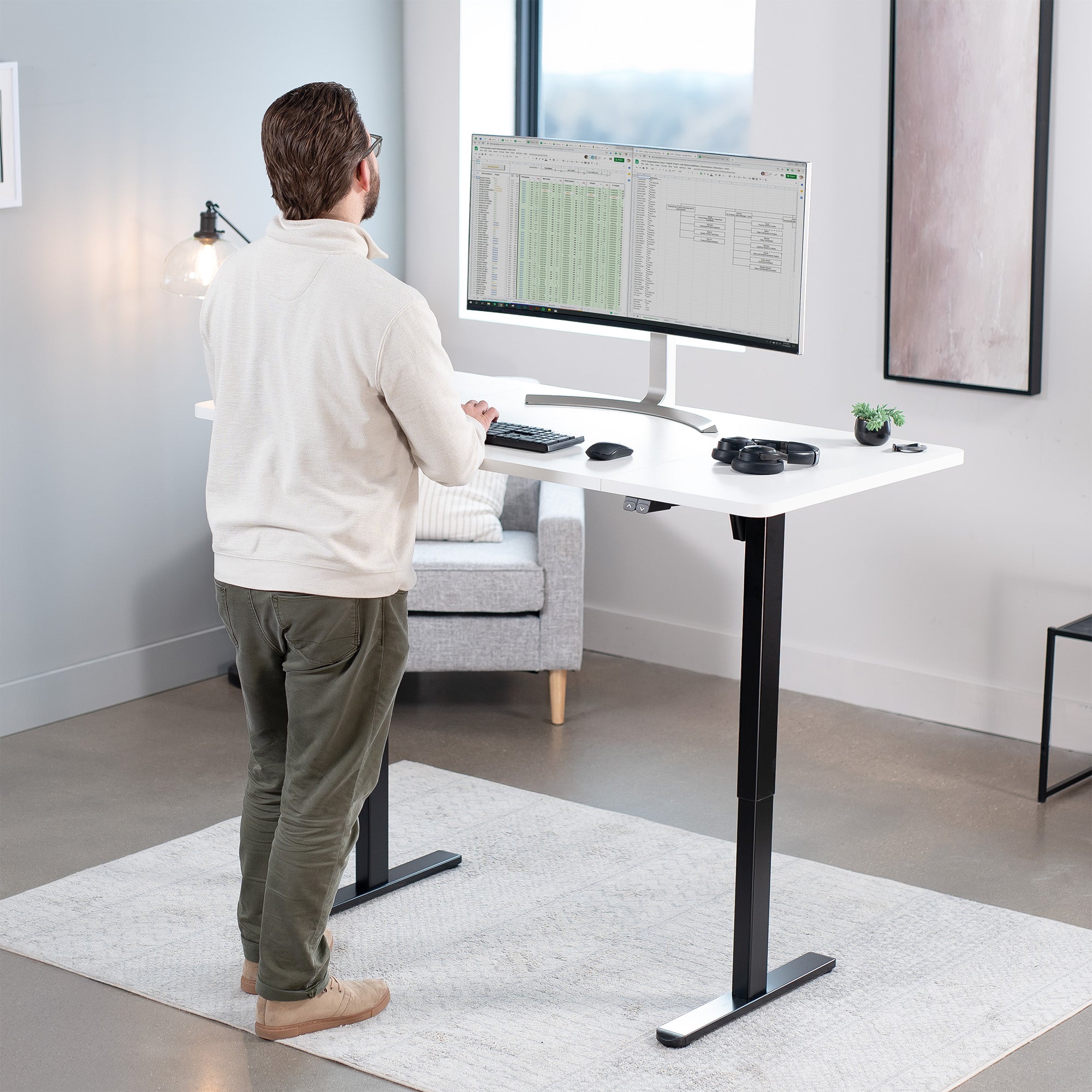 60 x 30 inch electric desk featuring easy height adjustment with the simple 2-button controller