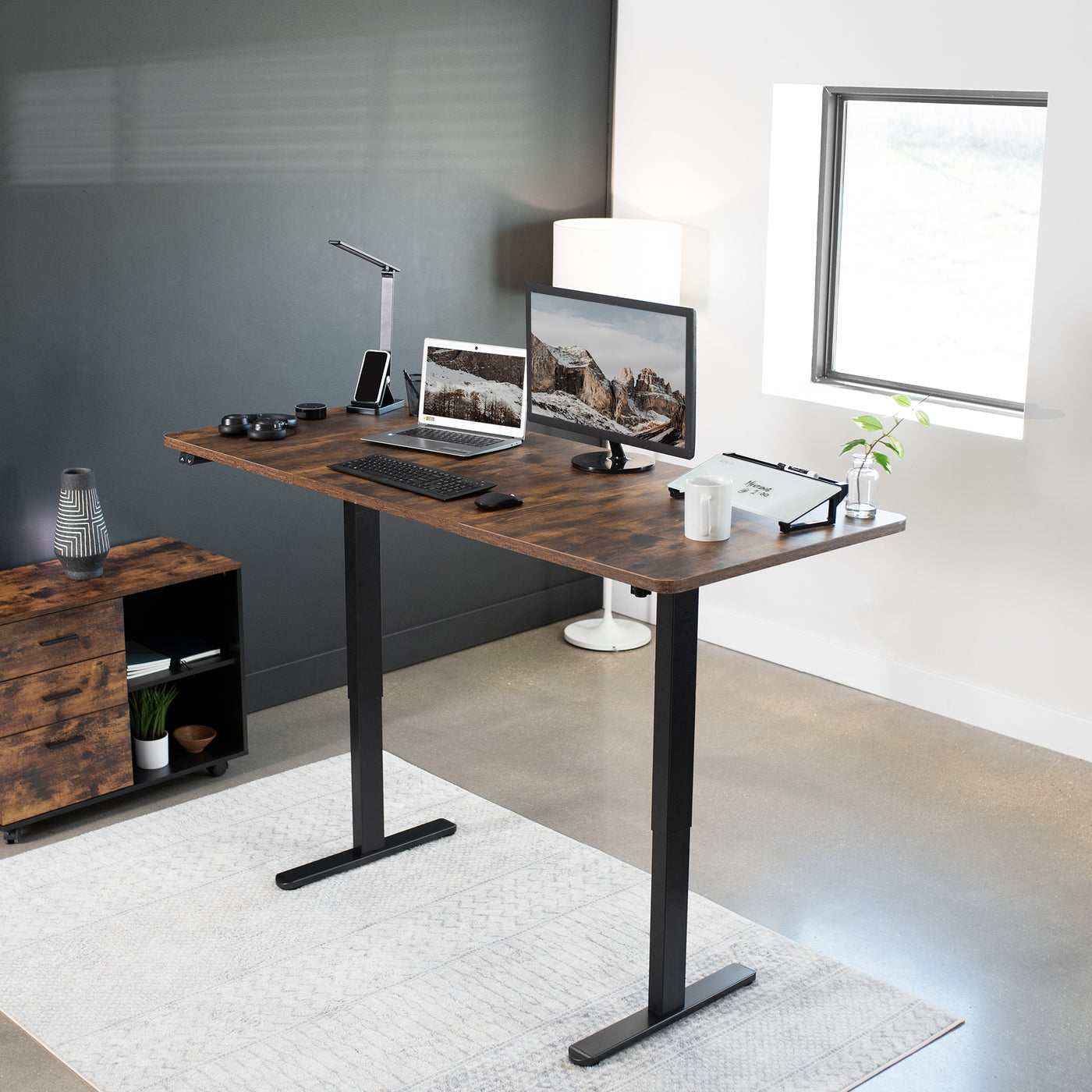 Rustic wide surface sturdy sit or stand active workstation with adjustable height using 2 button control panel.