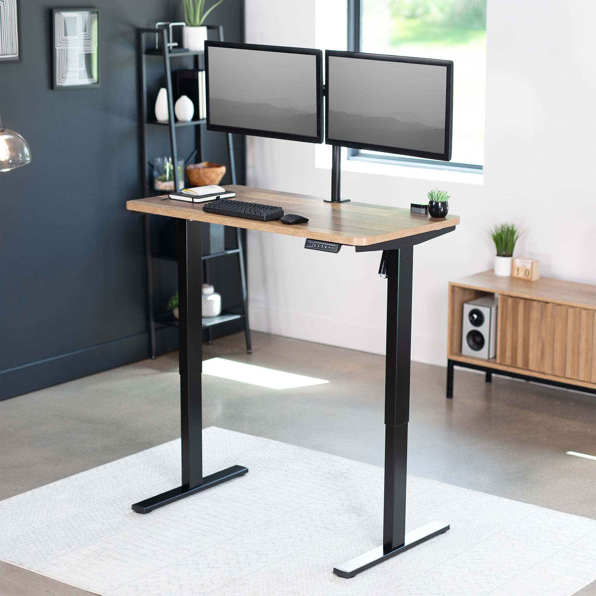 Sturdy ergonomic sit or stand active desk workstation with adjustable height using smart control panel.