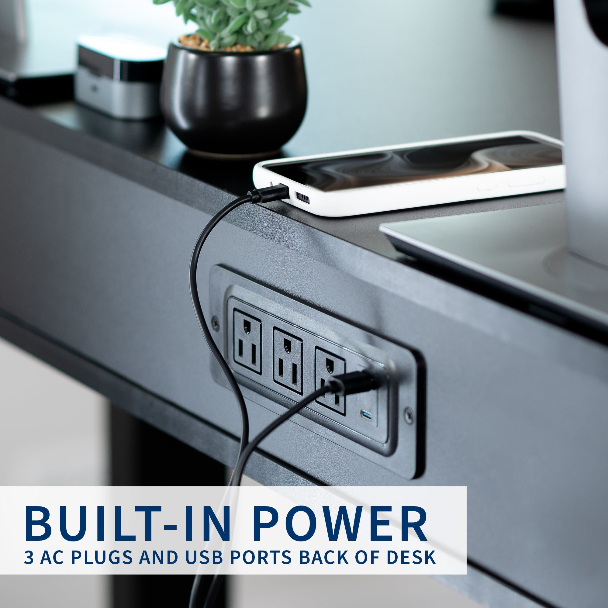 Heavy-duty electric height adjustable desk with drawers, built-in power strip, and memory controller.