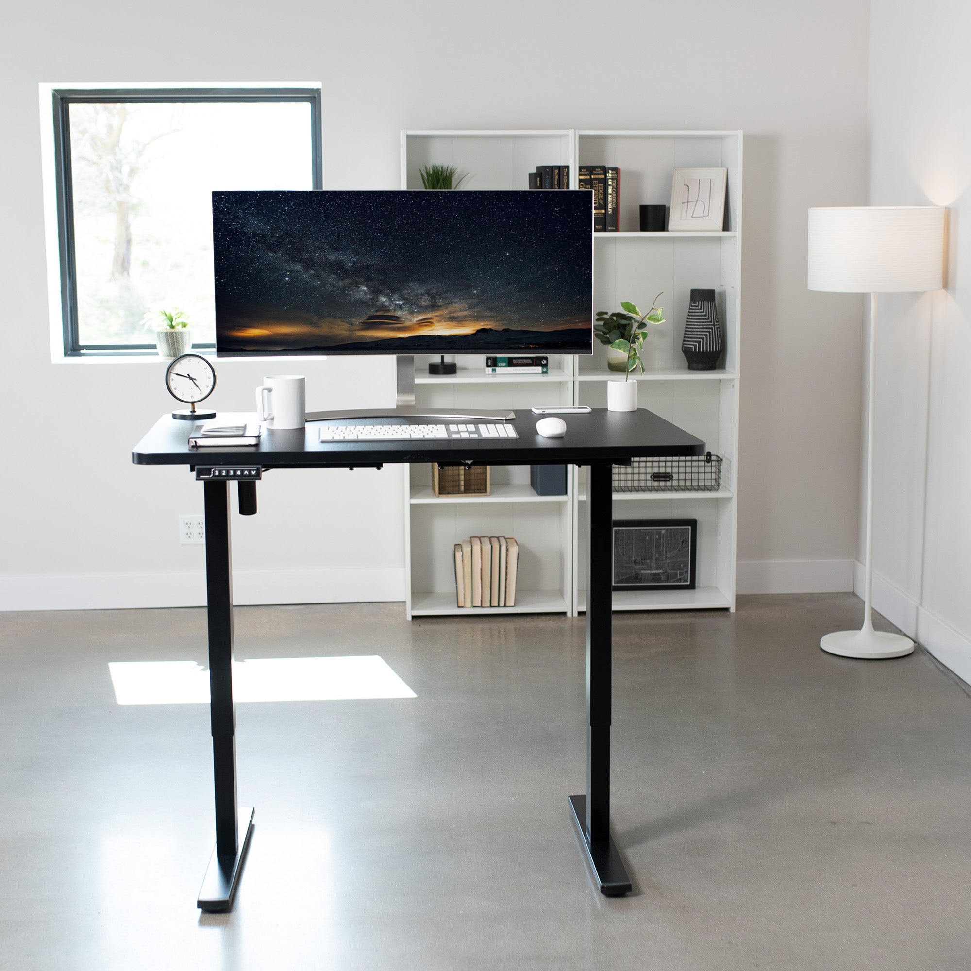 Sturdy ergonomic sit or stand active desk workstation with adjustable height using smart control panel.