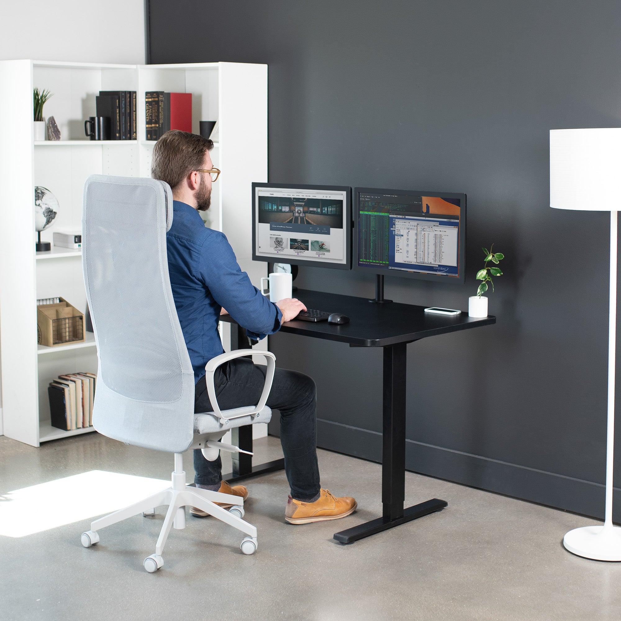 Sturdy ergonomic sit or stand active desk workstation with adjustable height using smart control panel.