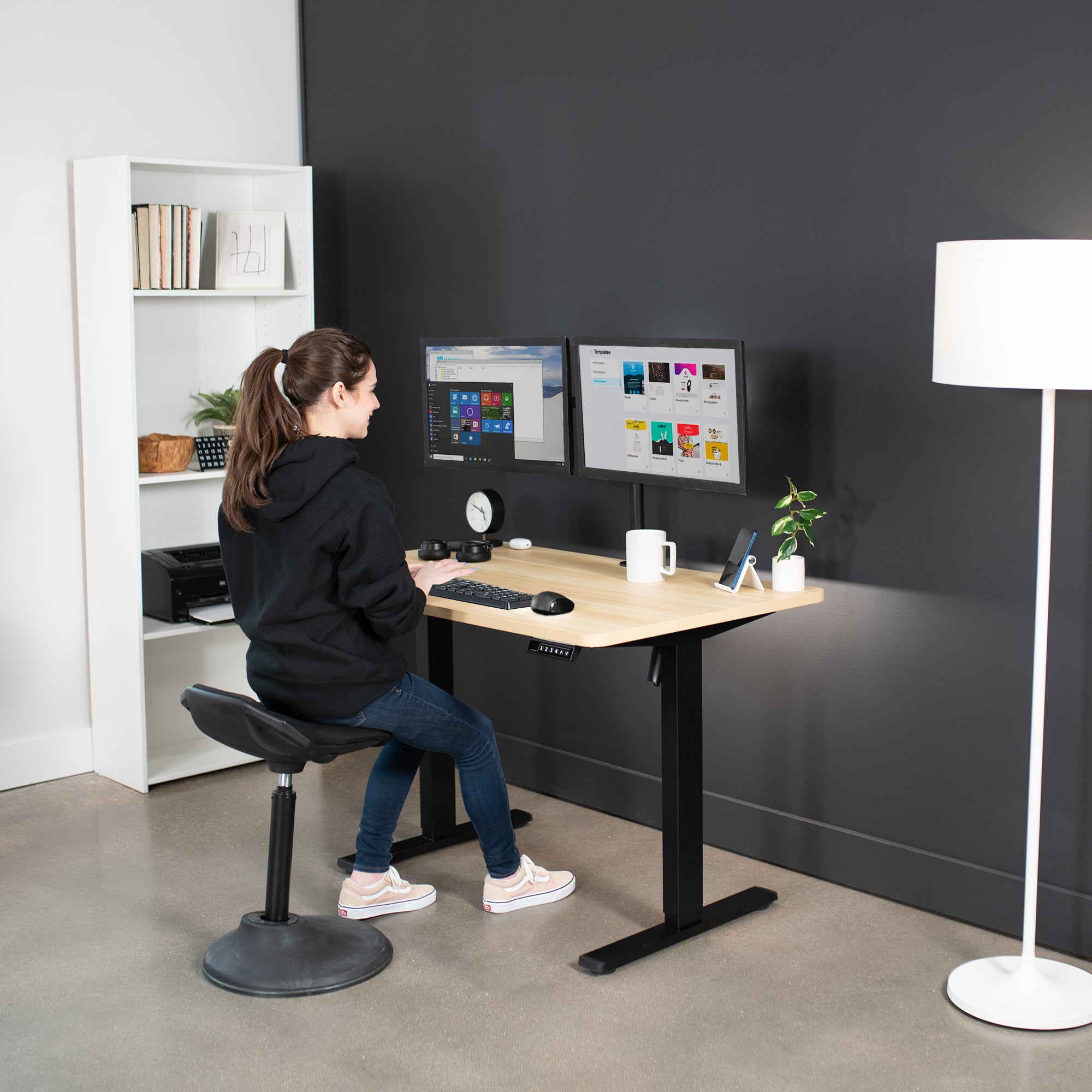 Sturdy ergonomic sit or stand active desk workstation with adjustable height using smart control panel.