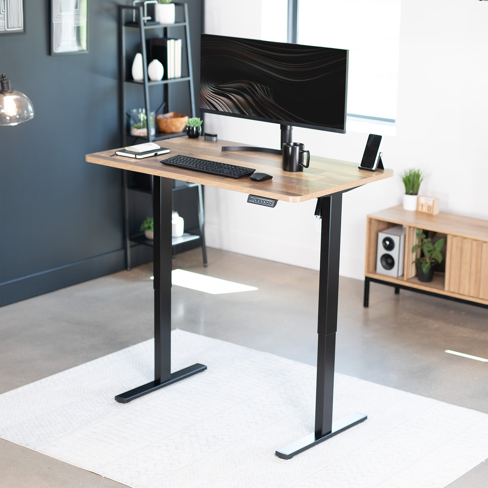 Sturdy ergonomic sit or stand active desk workstation with adjustable height using smart control panel.