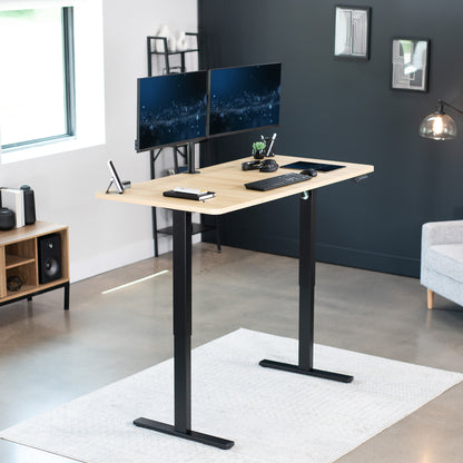 Sturdy ergonomic sit or stand active desk workstation with adjustable height using smart control panel.