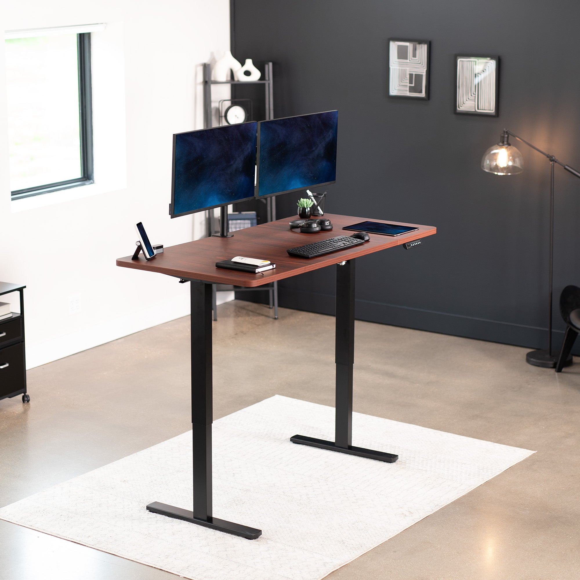 Sturdy ergonomic sit or stand active desk workstation with adjustable height using smart control panel.