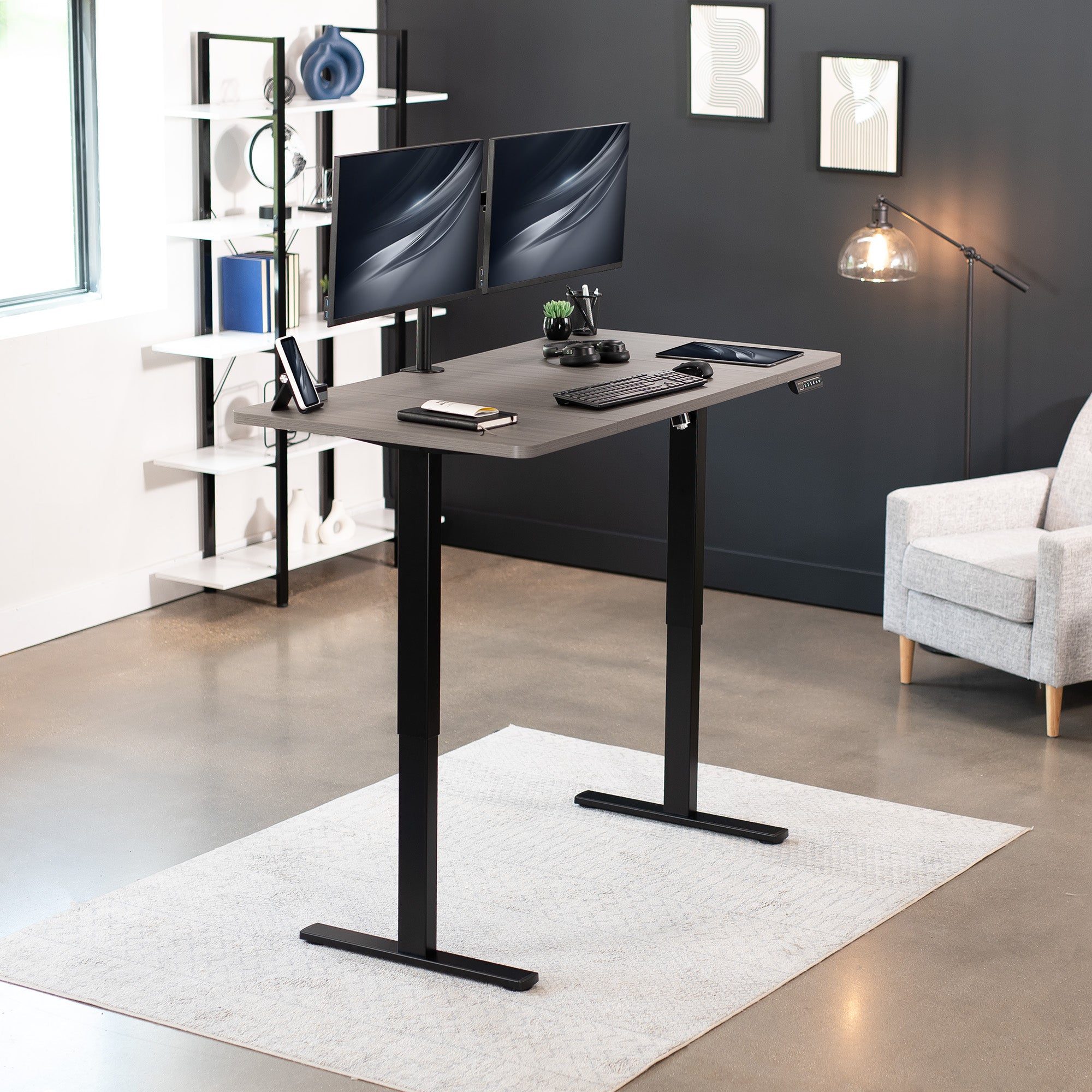 Sturdy ergonomic sit or stand active desk workstation with adjustable height using smart control panel.